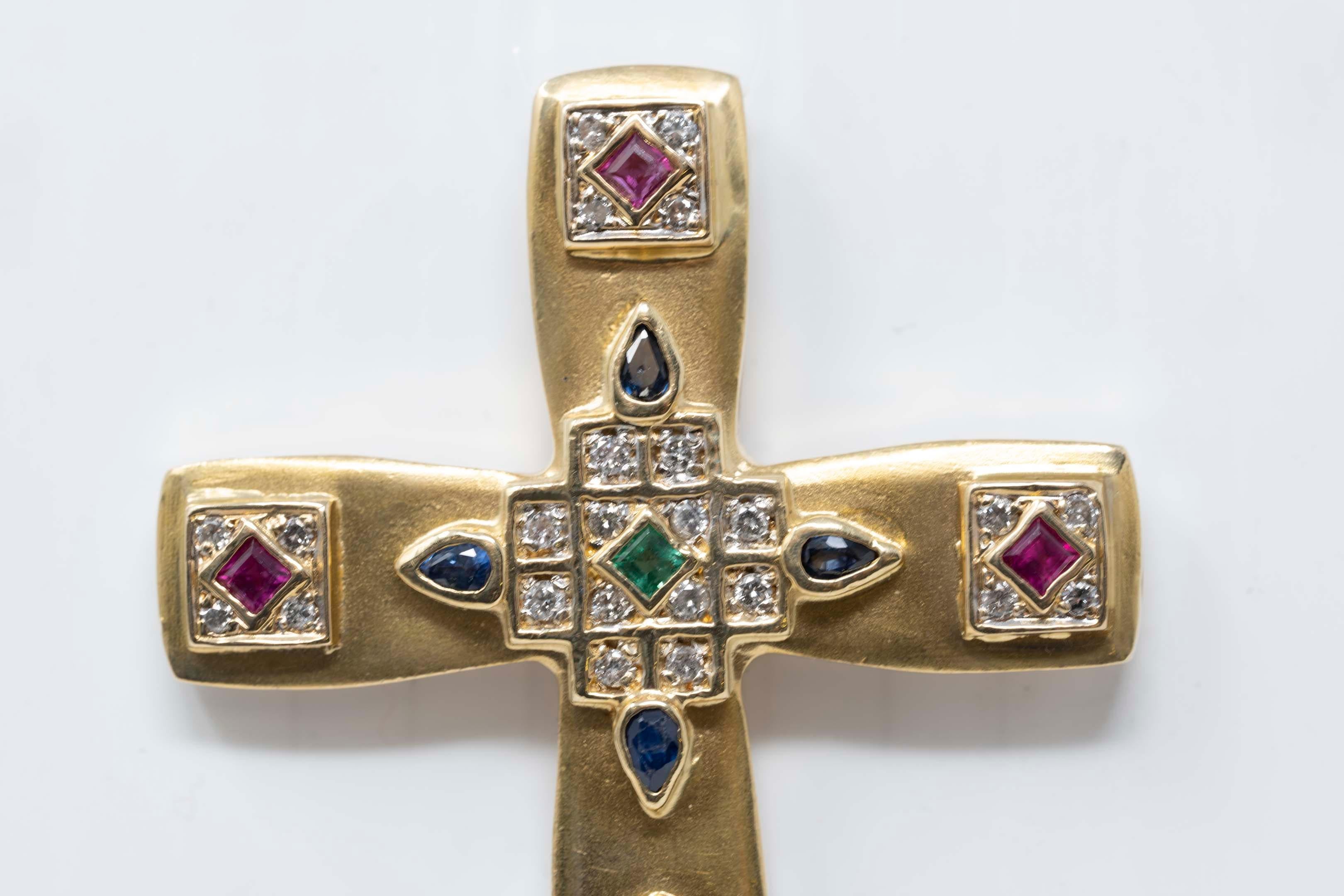 gold cross with stones