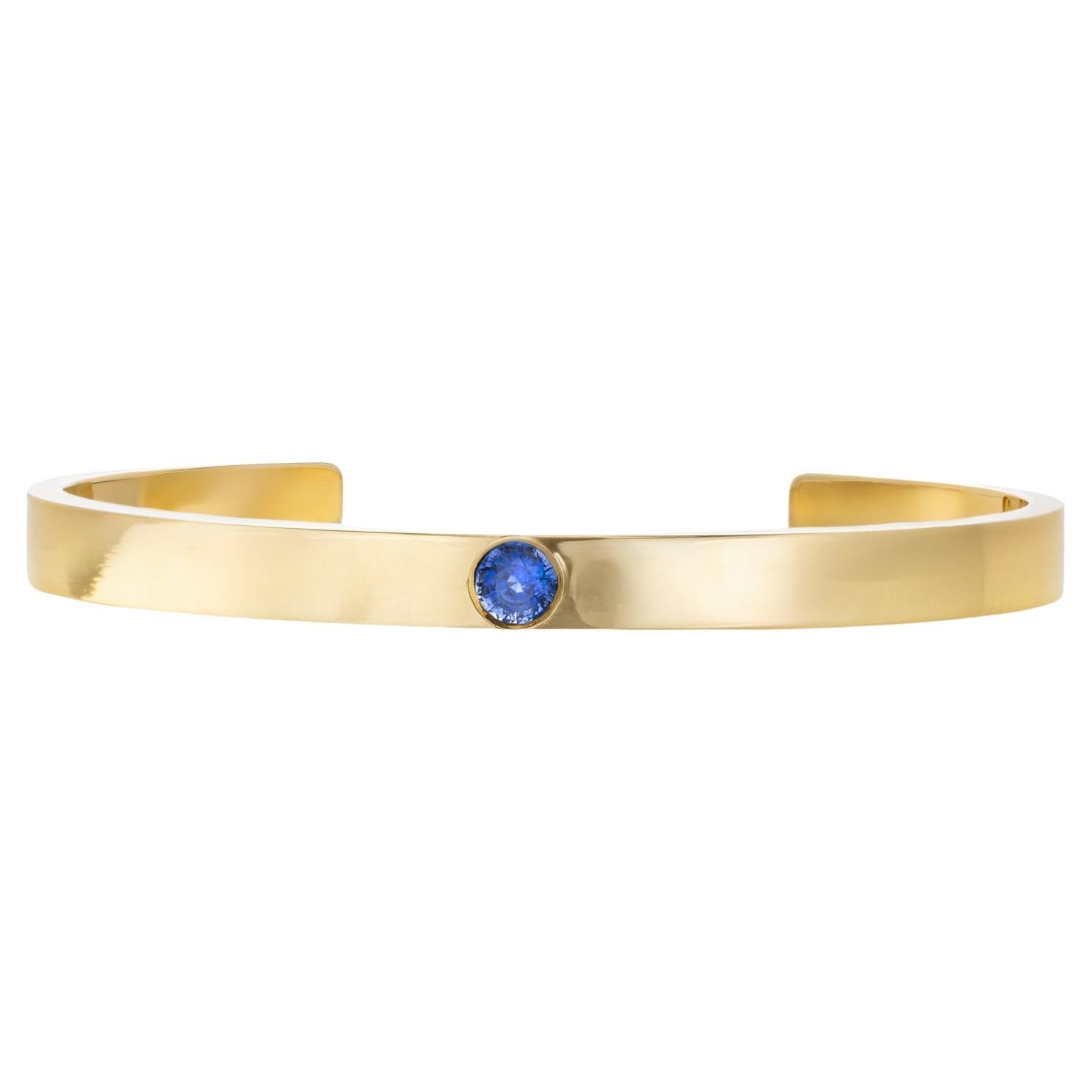 Bracelet manchette en or jaune 18K avec saphir de 0.70 carat