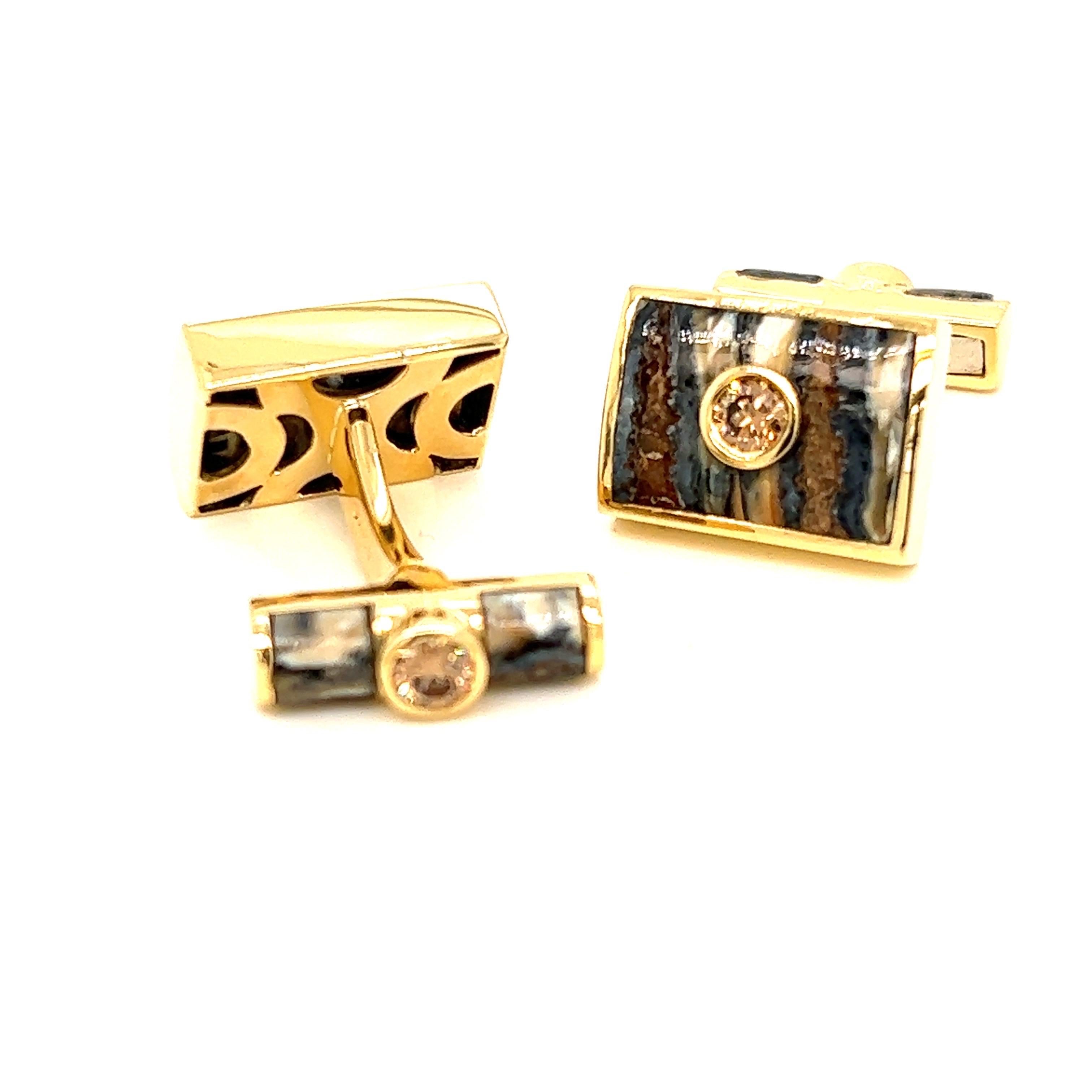 18k yellow gold cufflinks with fossilized mammoth tooth and 1.07tct of bronze diamonds. Swivel backing.

Approximate measurements: 
17mm x 12mm