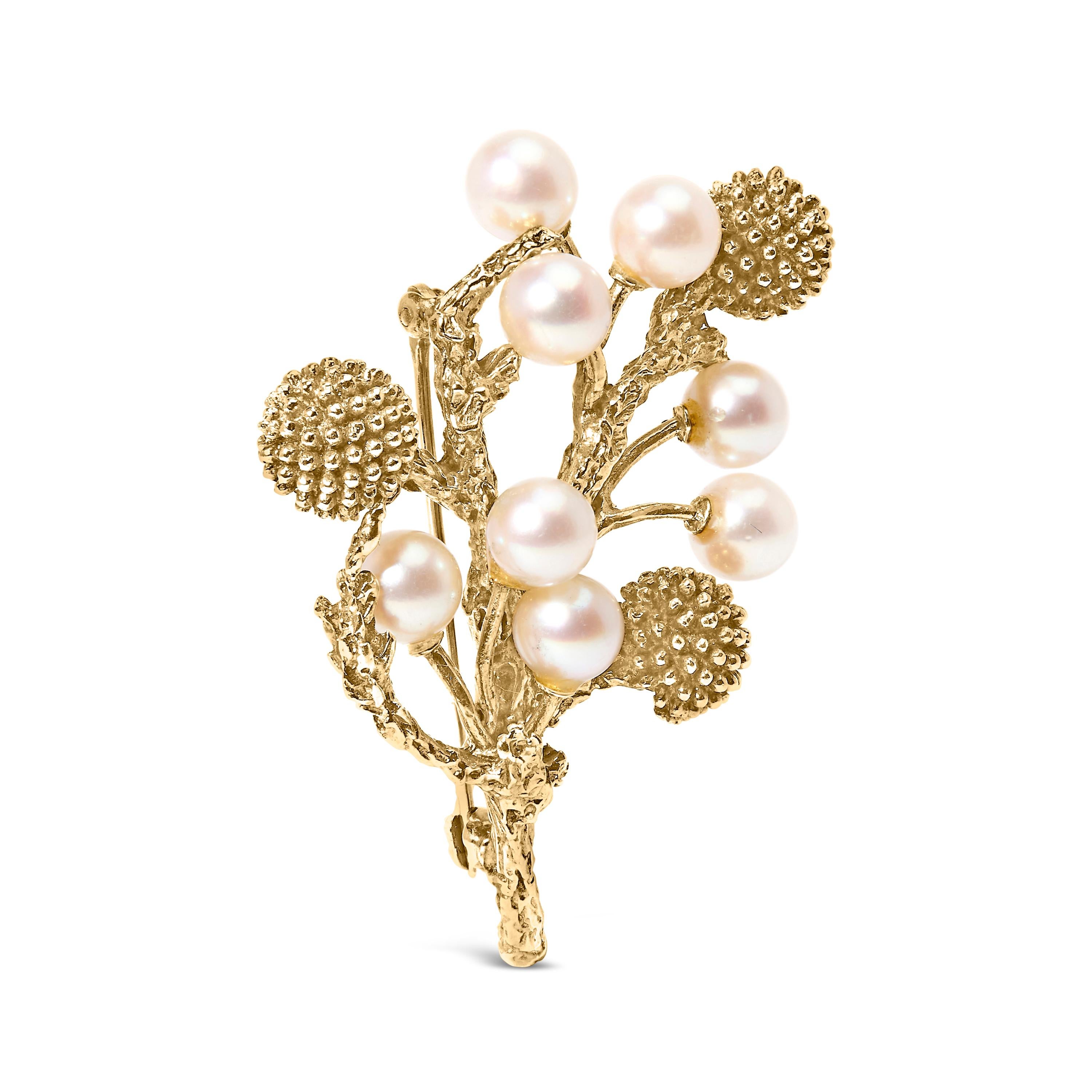 Discover the ethereal beauty of nature encapsulated in our exquisite brooch, a masterpiece forged from luminous 18k yellow gold with a unique hammered finish that mimics the textured surface of a real tree branch. Each twist and twirl of the gold