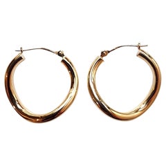 Pendientes de aro curvados de oro amarillo de 18 quilates #22785