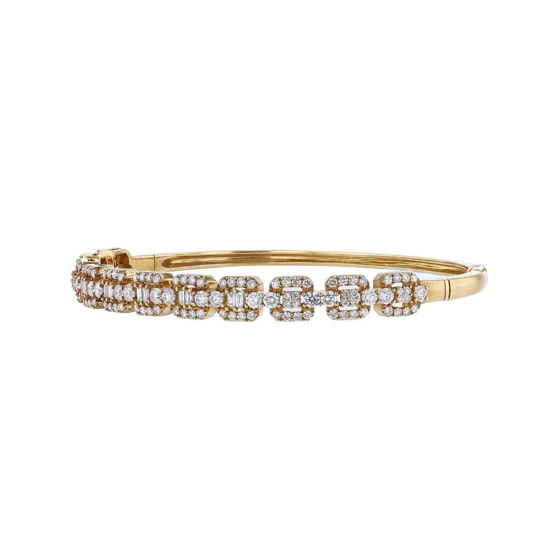 This bangle is made in 18K yellow gold. Features 11 cushion bezels with 134 round cut weighing 1.94ct. and 10 tapered baguette cut diamonds weighing 0.19ct. All stones are prong set. This bangle has a color grade (H) and a clarity grade of (SI2).
