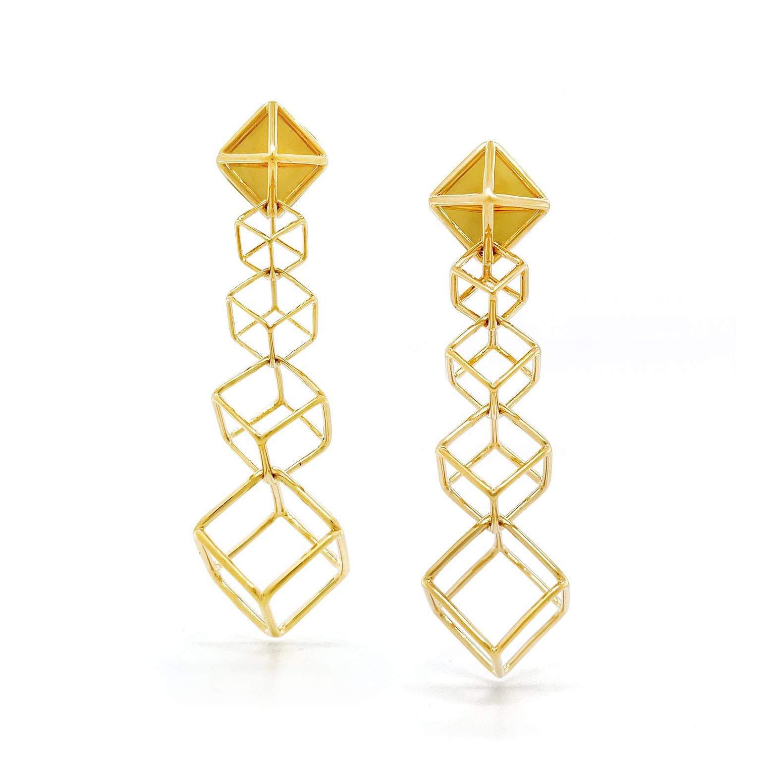 Geometric shapes are the inspiration for these earrings. Beginning with a polished openwork pyramid, follows a series of four cubes created from slender gold bars. The cubes ascend in size for sleek symmetrical design. Posts finish the earrings,