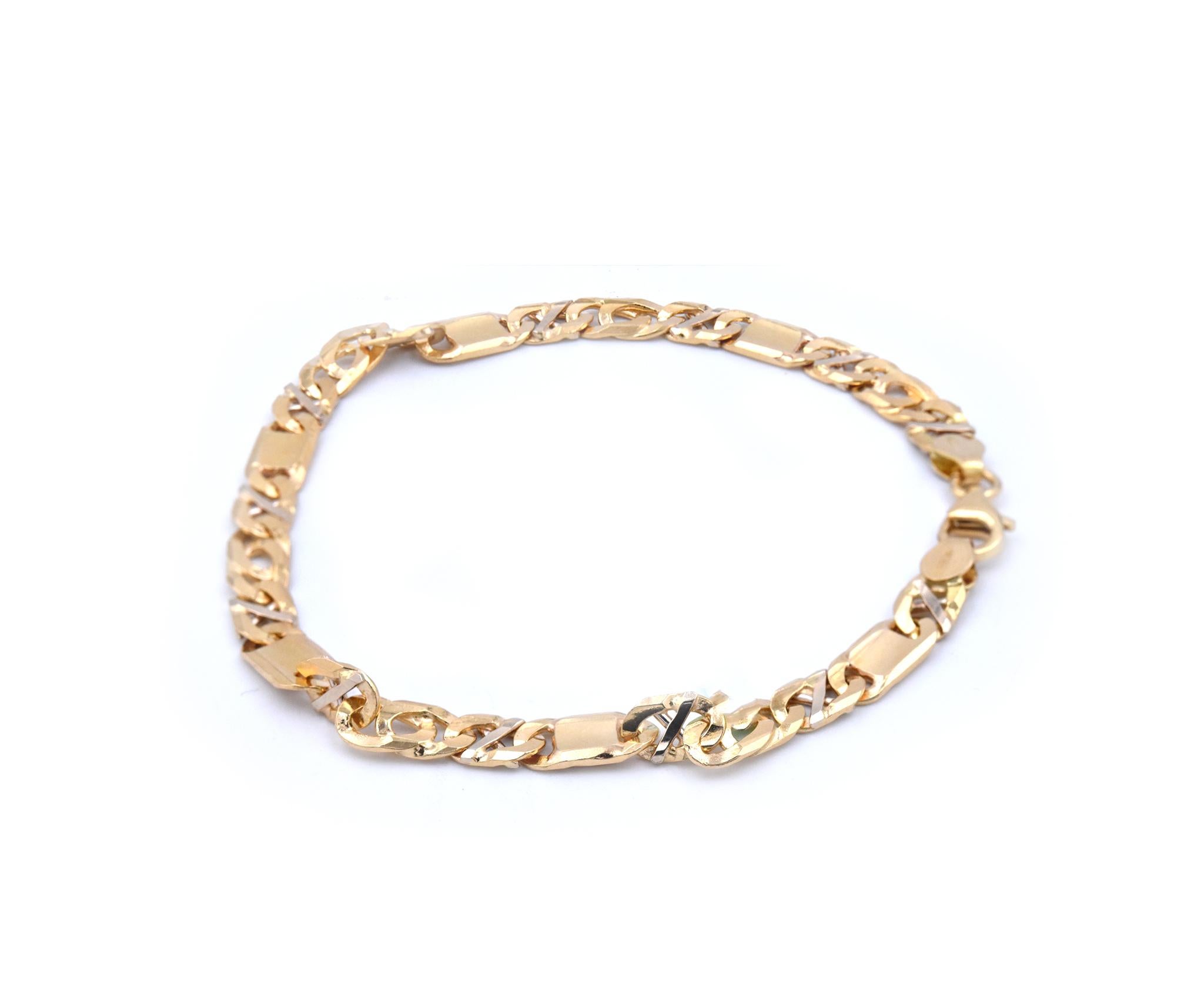Designer: Custom Design
Material: 18k yellow gold
Dimensions: bracelet measures 8-inches in length, 6mm in width
Weight: 15.4 grams