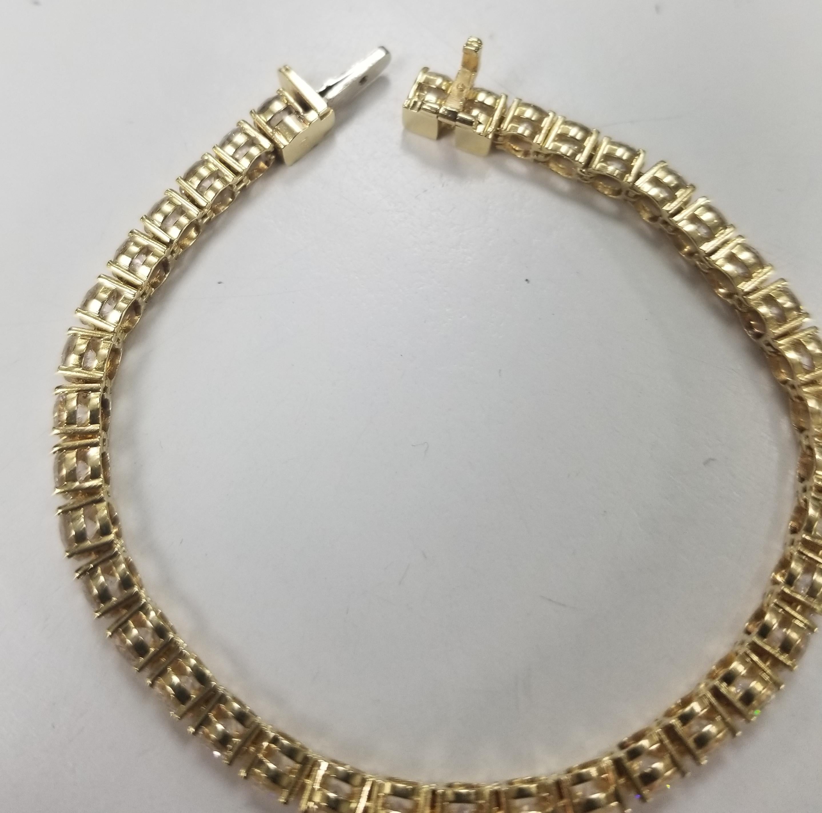 This is very beautiful 18k yellow gold custom made tennis bracelet with 38 round diamonds color F and clarity VS2-SI1 weighing 9.50cts. very fine quality diamonds, bracelet measures 6 inches with clasp and safety.
Specifications:
    main stone: