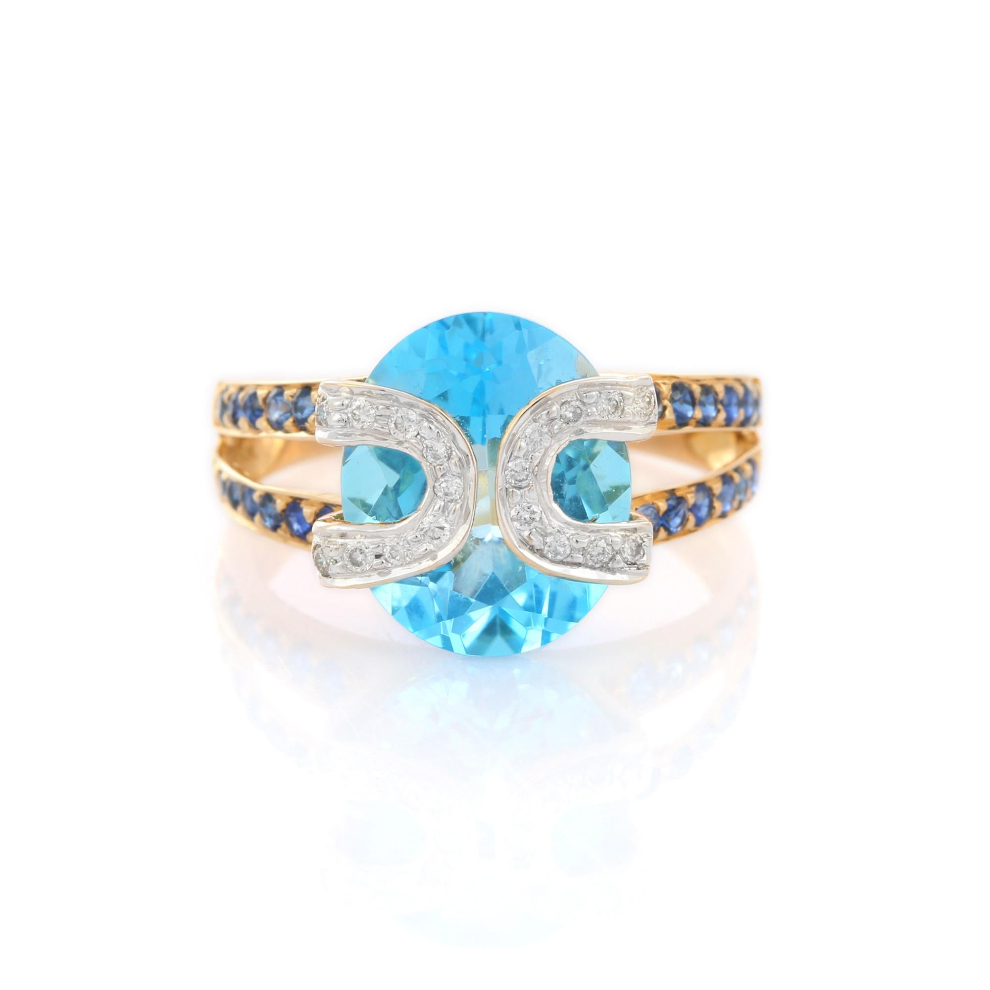 For Sale:  18K Yellow Gold Designer Blue Topaz Cocktail Ring with Sapphire and Diamonds 7