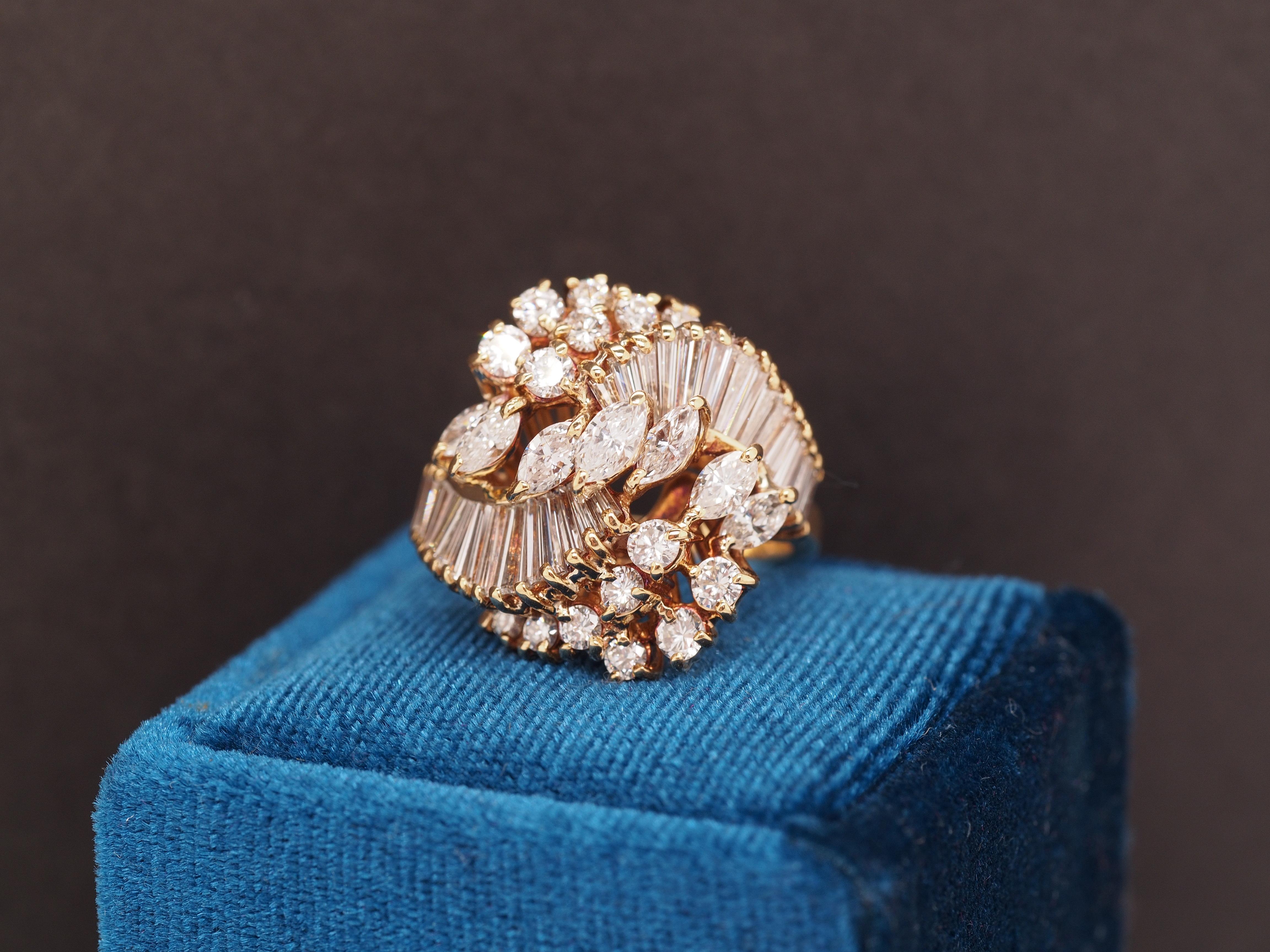 Year: 1990s
Item Details:
Ring Size: 6
Metal Type: 18K Yellow Gold [Hallmarked, and Tested]
Weight: 8.3 grams
Serial Numbers on Inner Shank: 16811
Diamond Details:
Natural Diamonds. Marquise, Baguette and Round Brilliant shapes. 3.00ct total weight,