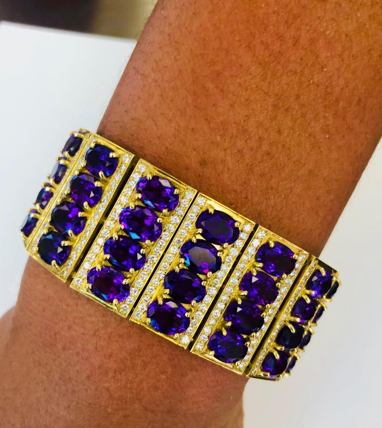 This very impressive Bracelet is made in 18K Yellow Gold perfectly constructed, set with 450 Diamonds 6.95 carats and 60 oval Amethysts 70.00 carats.
Bracelet Width: 1.0 Inch ( 2.5 CM ).

We design and manufacture our jewelry in our workshop,