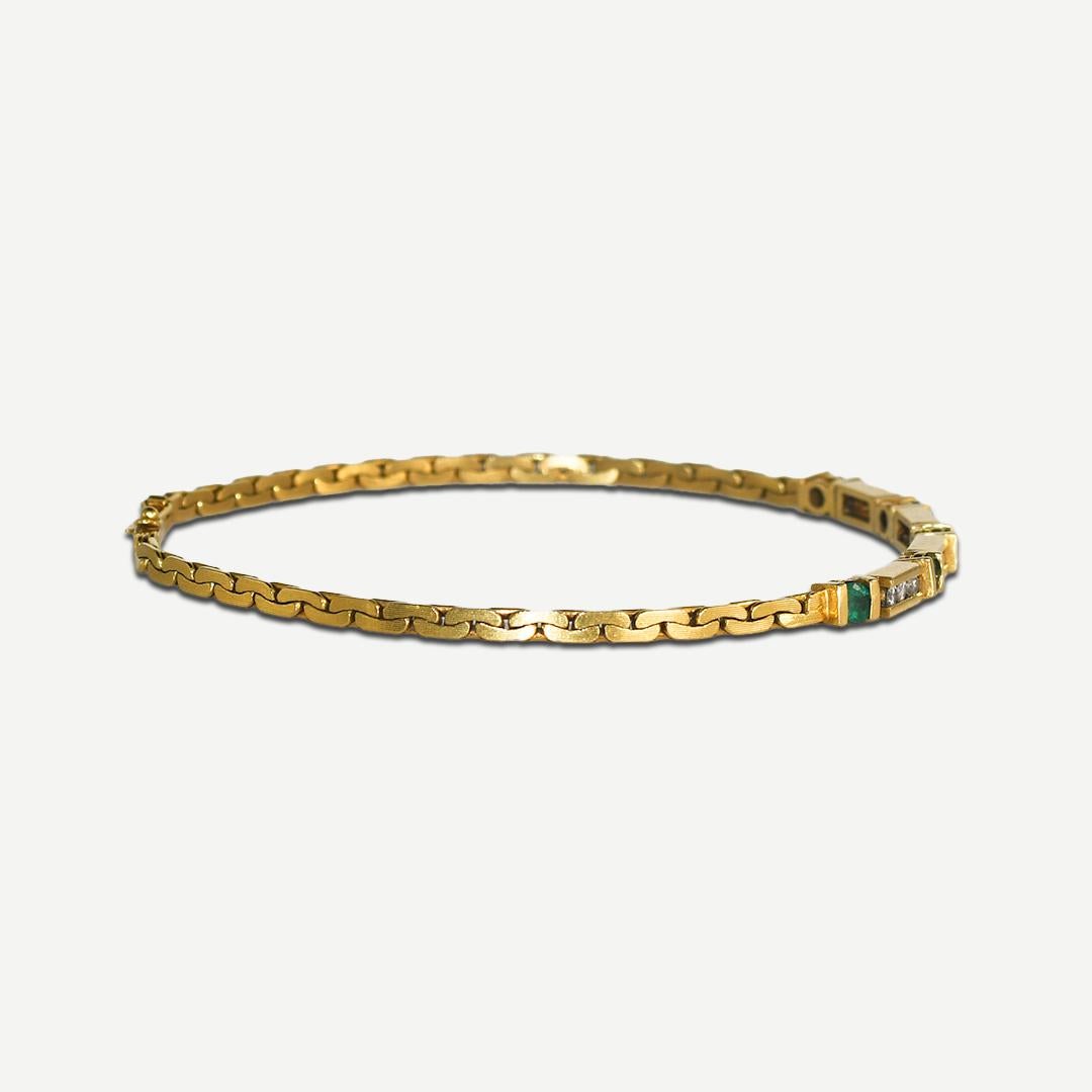 Armband aus 18 Karat Gelbgold mit Diamanten und Smaragden 8.8 g (Rundschliff)