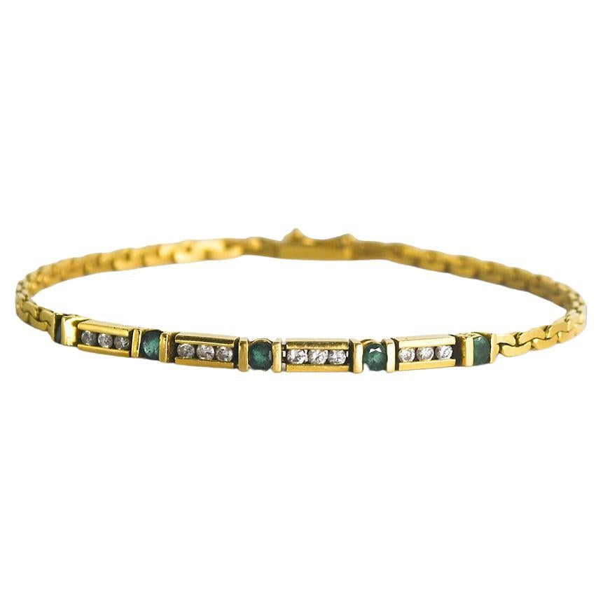 Armband aus 18 Karat Gelbgold mit Diamanten und Smaragden 8.8 g