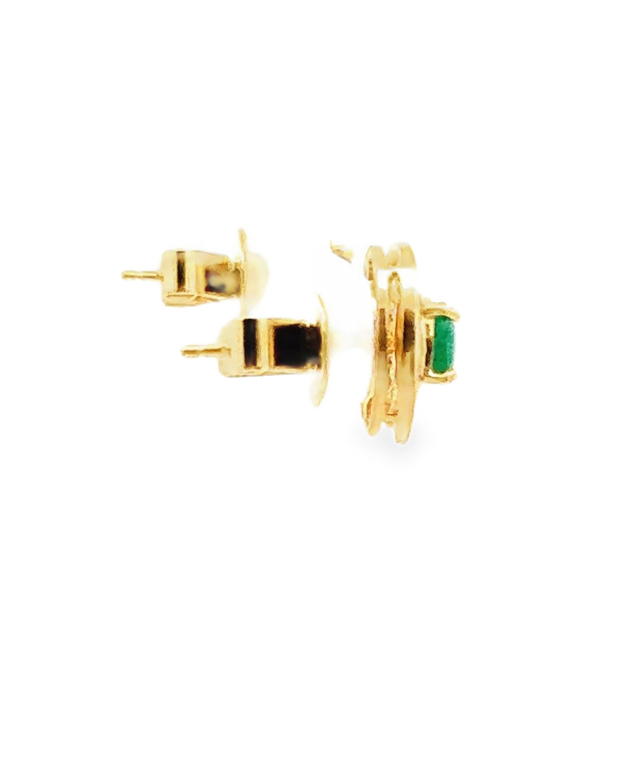 Contemporary 18K Yellow Gold Oval Emerald Pushback Stud Earrings with Baguette Diamond Halos For Sale