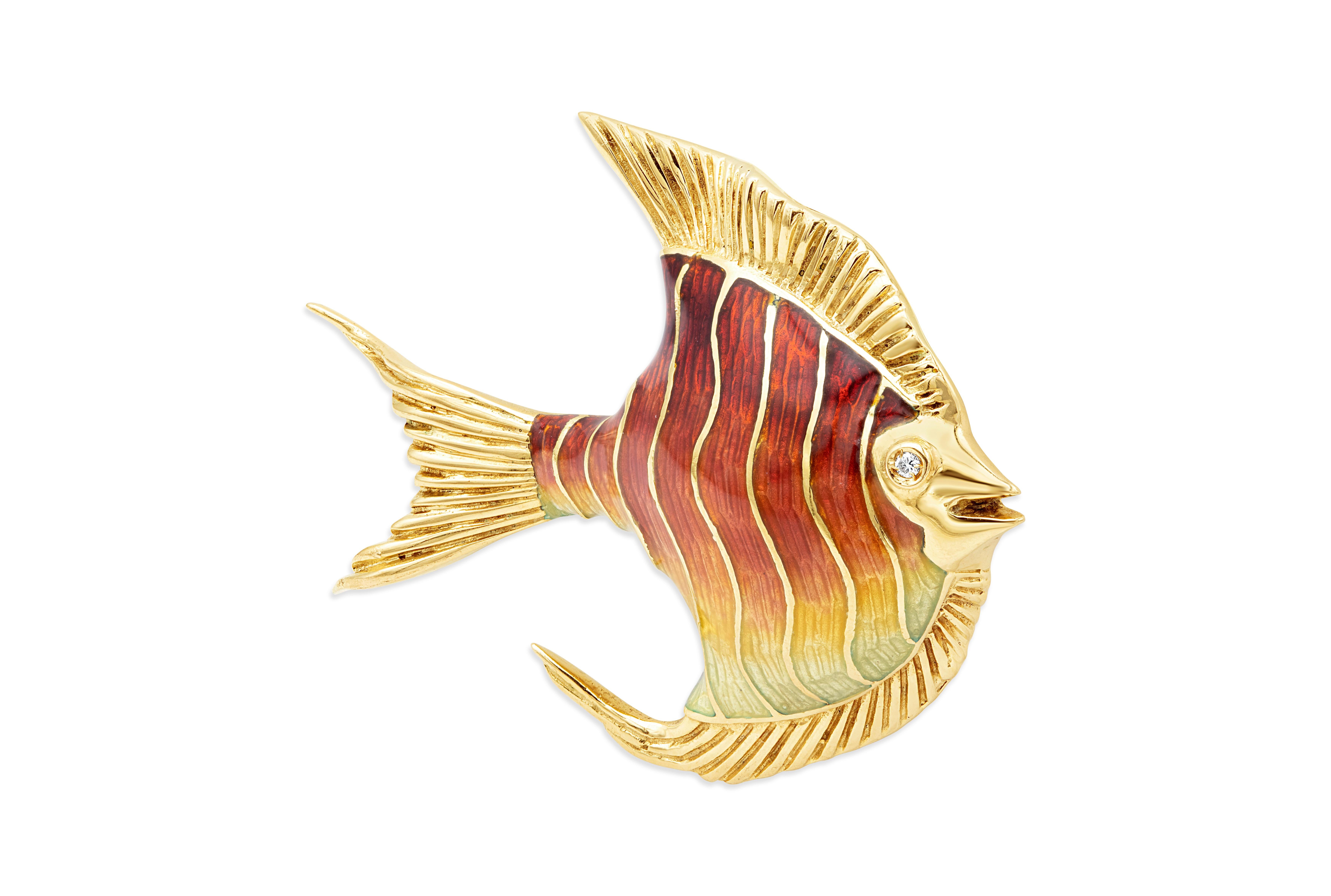 A well-crafted 18K Yellow Gold brooch in an Angel fish design accented with red enamel and round brilliant diamond eyes.

