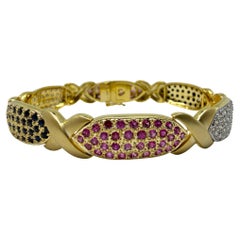 Bracelet en or jaune 18K avec diamants et saphirs multicolores