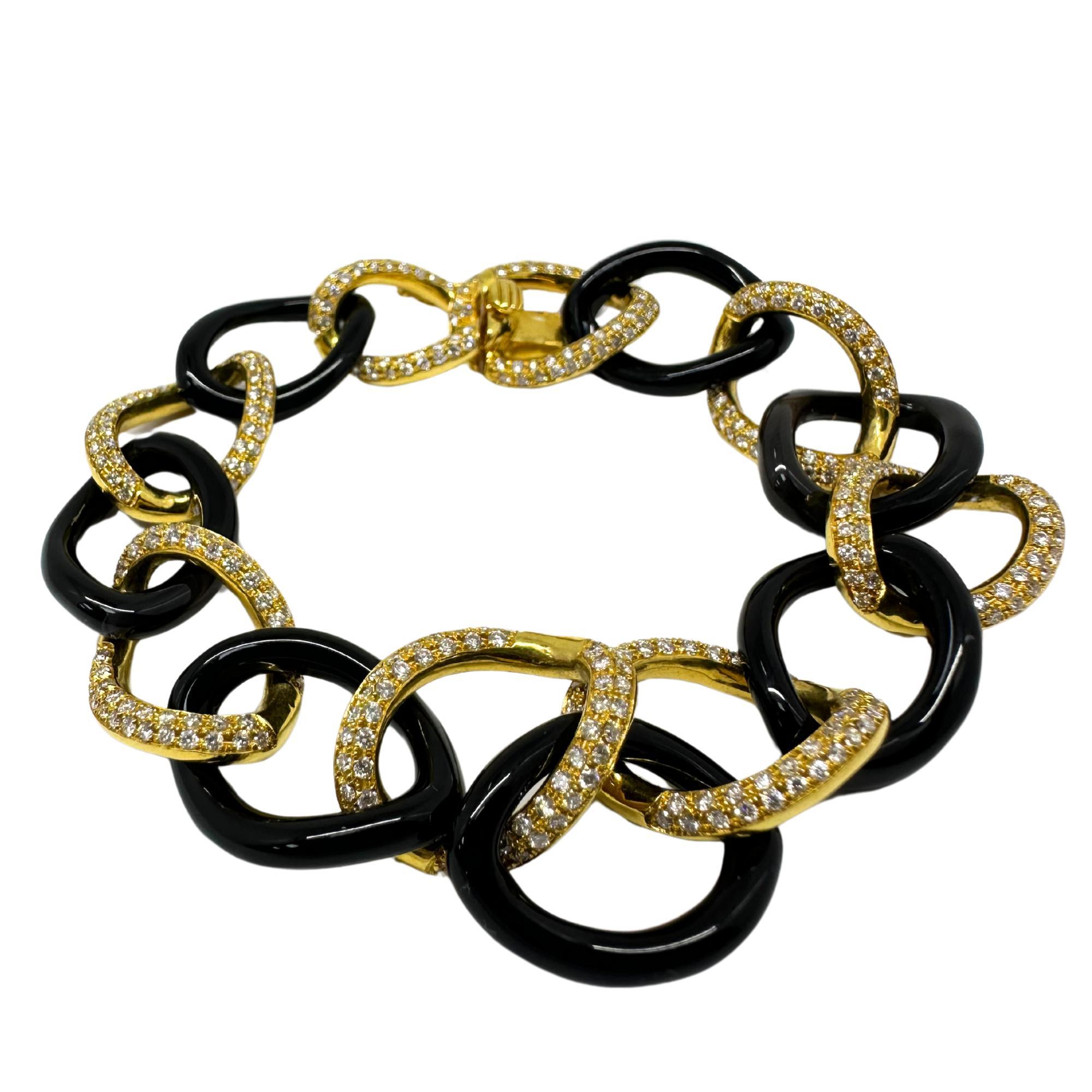 18K Gelbgold Diamant und Onyx Gliederarmband
Zustand: In gutem Zustand mit leichten altersbedingten Oberflächenabnutzungen.
Länge: 8 Zoll lang, 0,60 Zoll breit 
Metall: 18K Gelbgold
Abmessungen: 