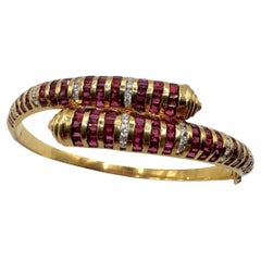 Armband aus 18 Karat Gelbgold mit Diamanten und Rubinen