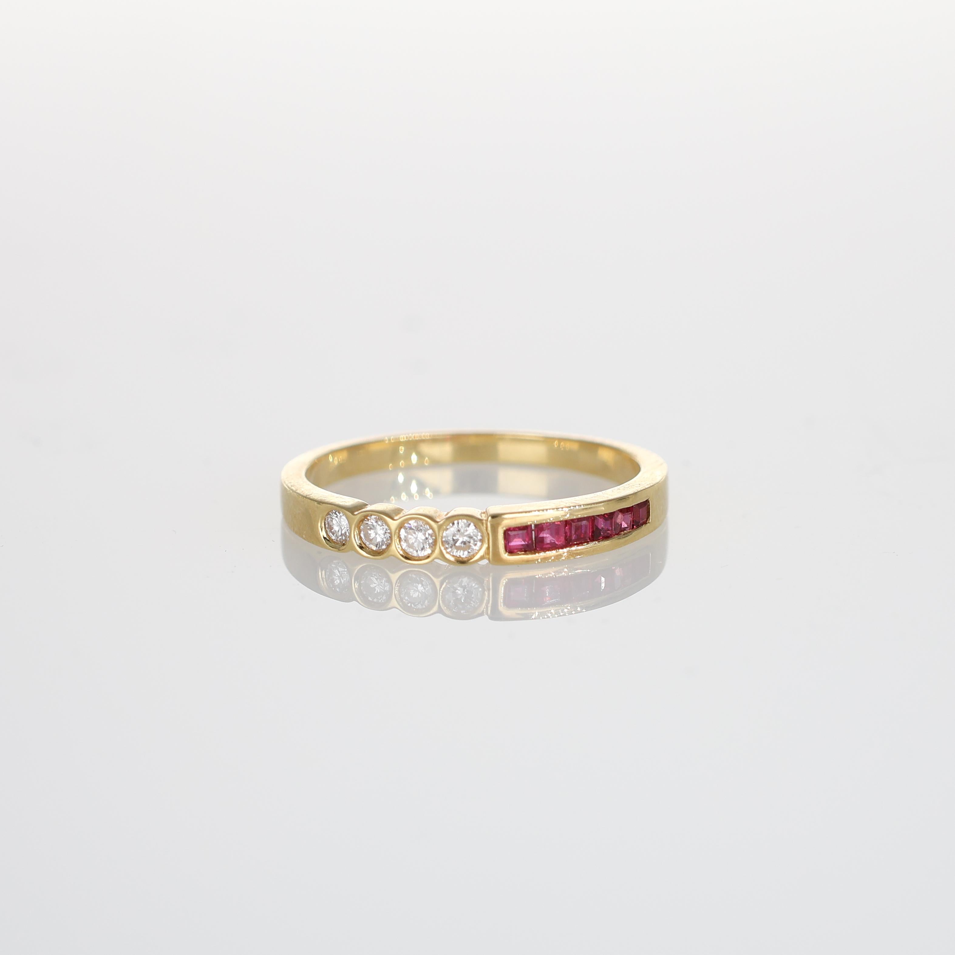 This elegant 18k yellow gold rivière ring combines sparkling diamonds and vivid rubies in a sleek, contemporary design. Featuring five round brilliant-cut diamonds and a row of square-cut rubies, this piece exudes refined sophistication. Perfect as