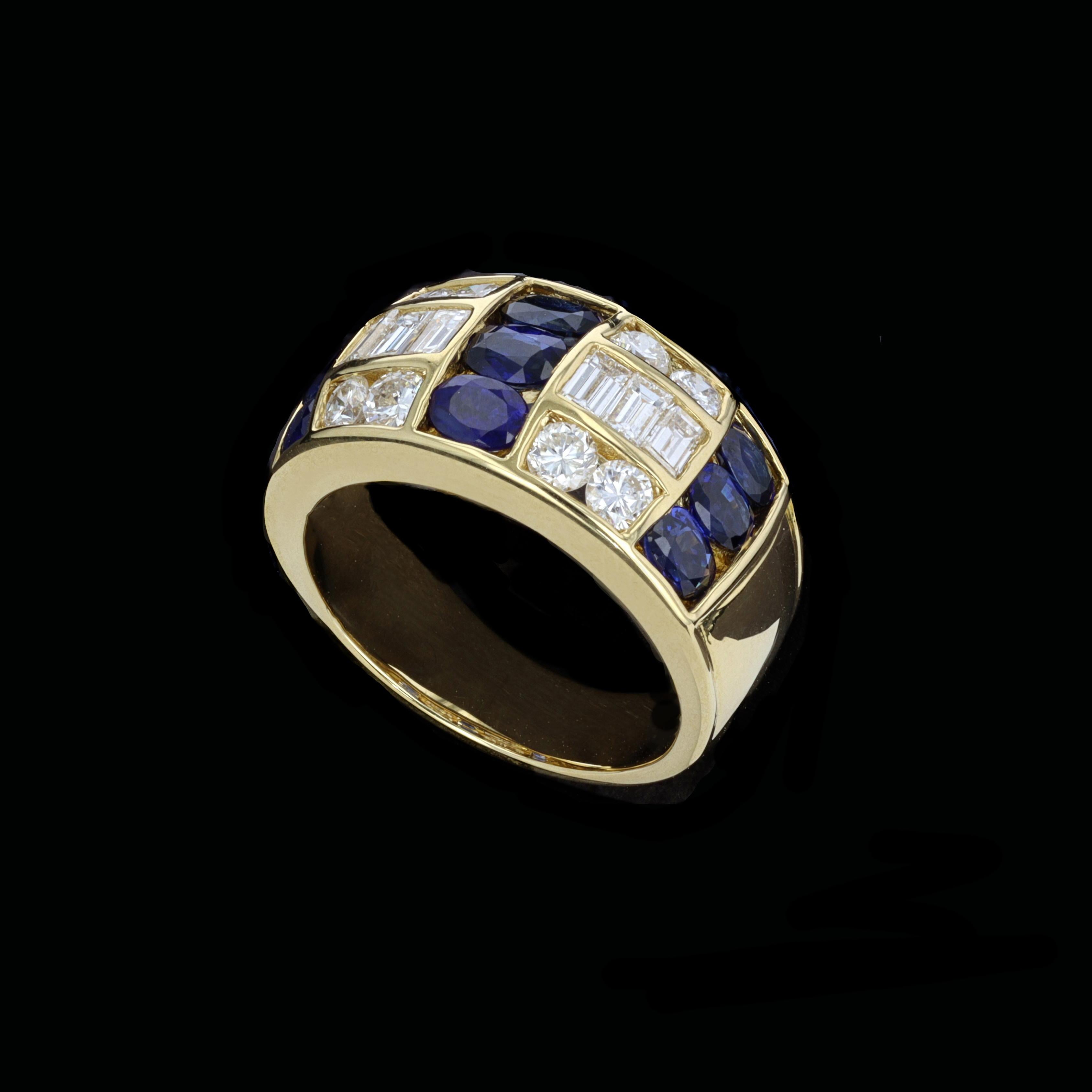 Layers of lovliness to be found in this1.15ct Diamond 1.91ct Sapphire 18k Yellow Gold Ring. The ring is set with sparkling round and emerald cut diamonds that weigh approximately 1.15ct. The color of these diamonds is F-G with VS clarity. The