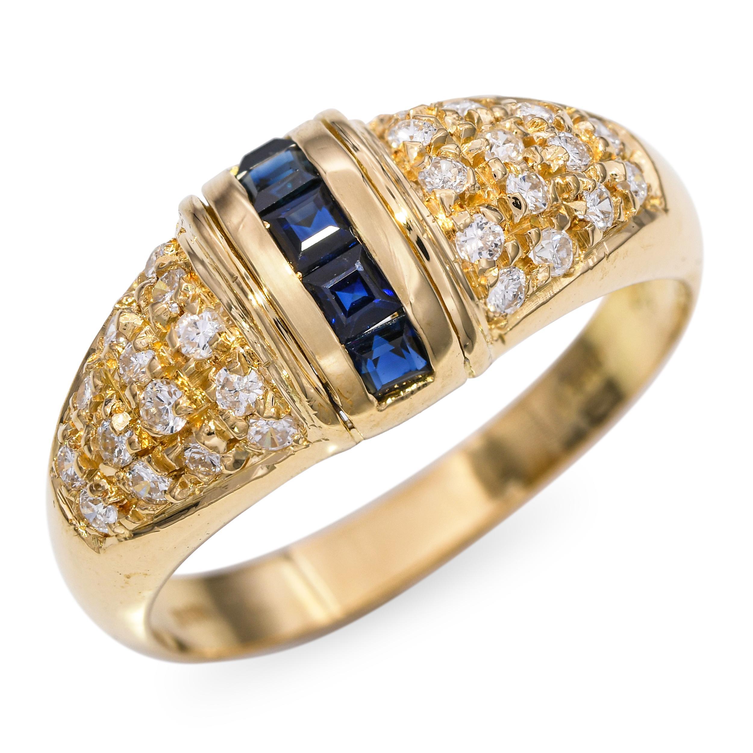 Bague en or jaune 18k, diamant et saphir, un design vintage saisissant mettant en valeur de riches saphirs bleus complétés par des diamants étincelants, le tout serti dans de l'or jaune 14k chaleureux. Les pierres précieuses sont disposées dans une