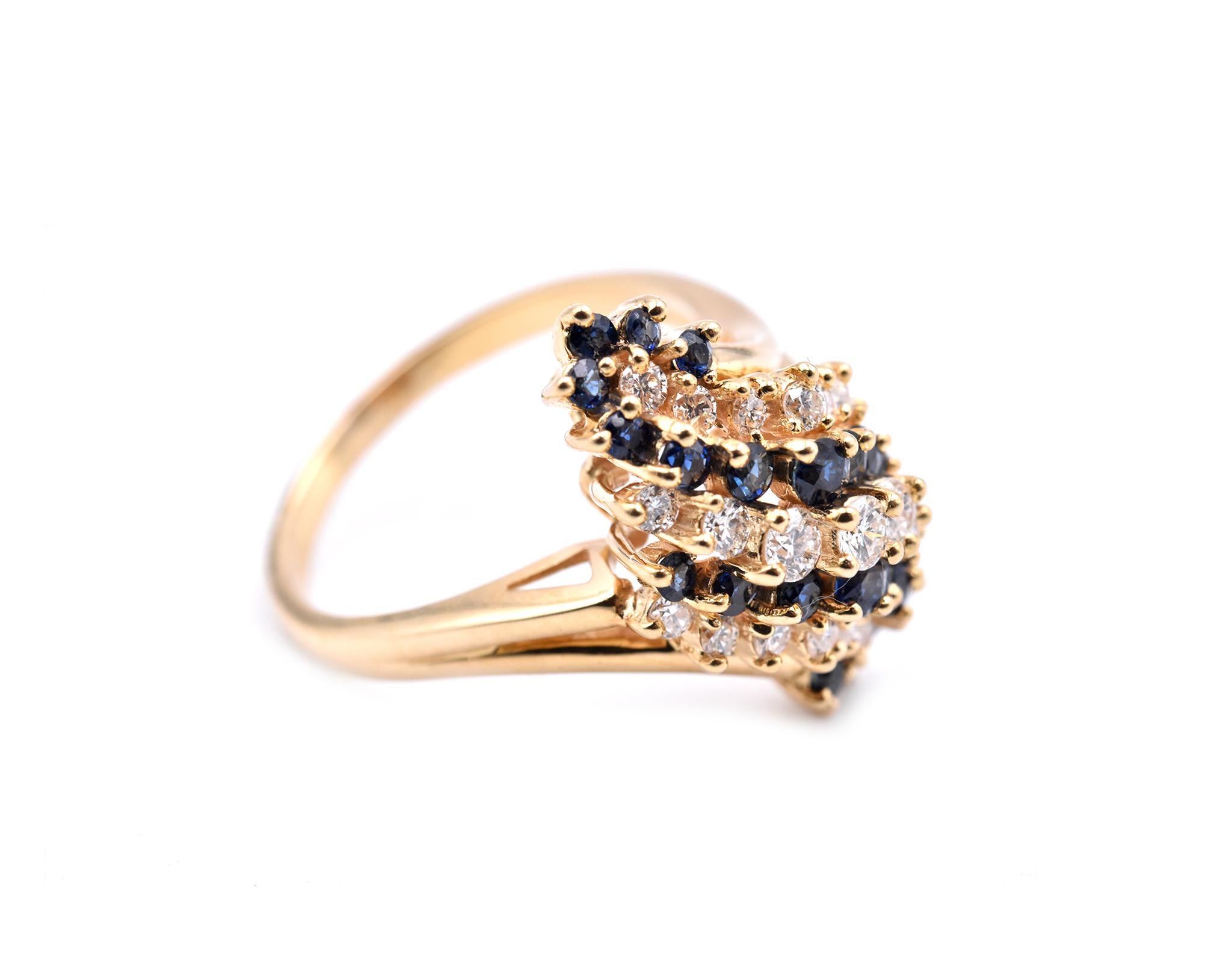 Designer: custom design
Material: 18k yellow gold
Sapphire: sapphires = .50cttw
Diamonds: 21 round brilliant cut = 0.80cttw
Color: G
Clarity: VS
Ring size: 7 ½ please allow two additional shipping days for sizing requests) 
Dimensions: ring top is