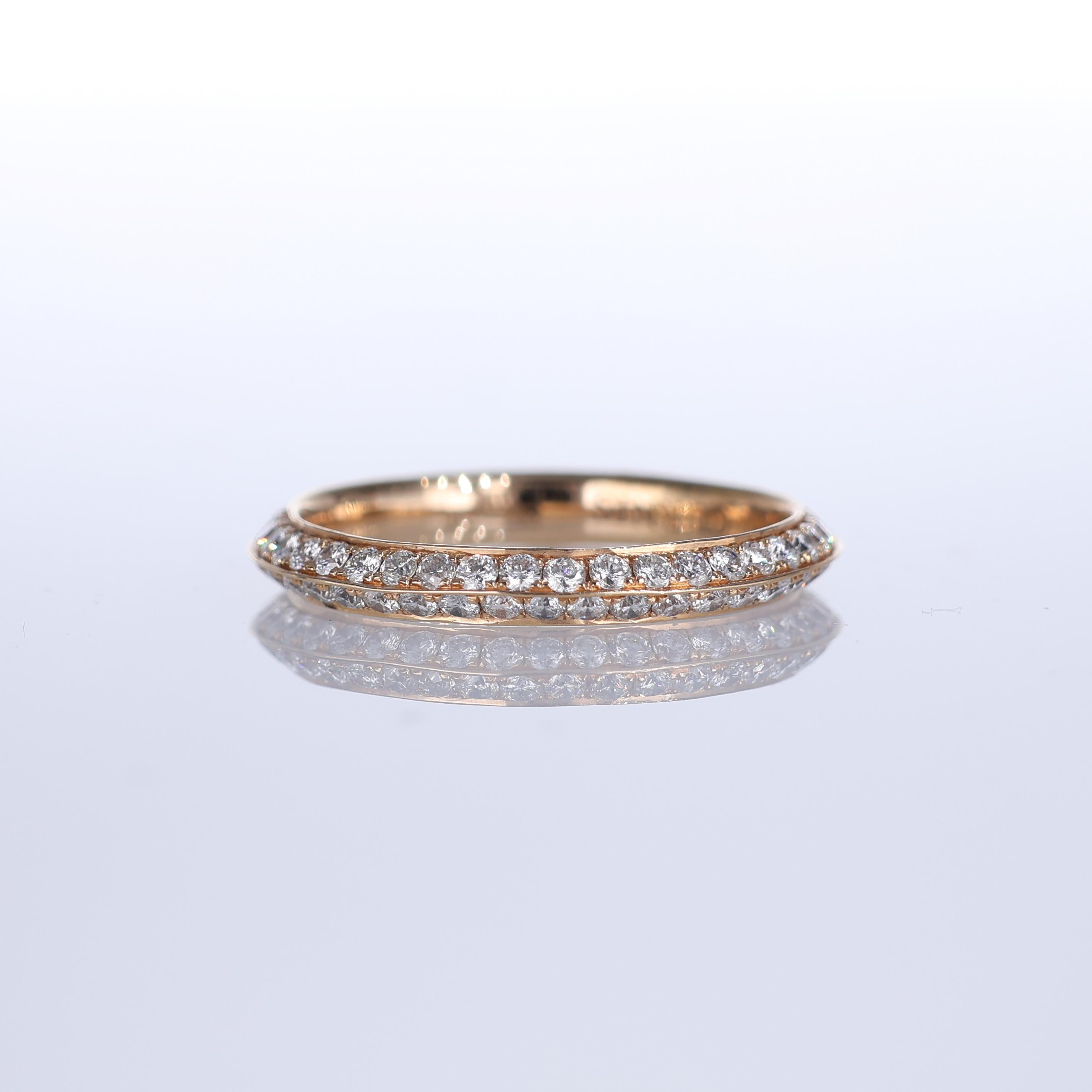 A refined band ring crafted in 18K yellow gold, adorned with 1.78 carats of brilliant-cut diamonds. The delicate yet radiant design enhances the sparkle of each diamond, creating a timeless piece with understated elegance. Ideal for those who