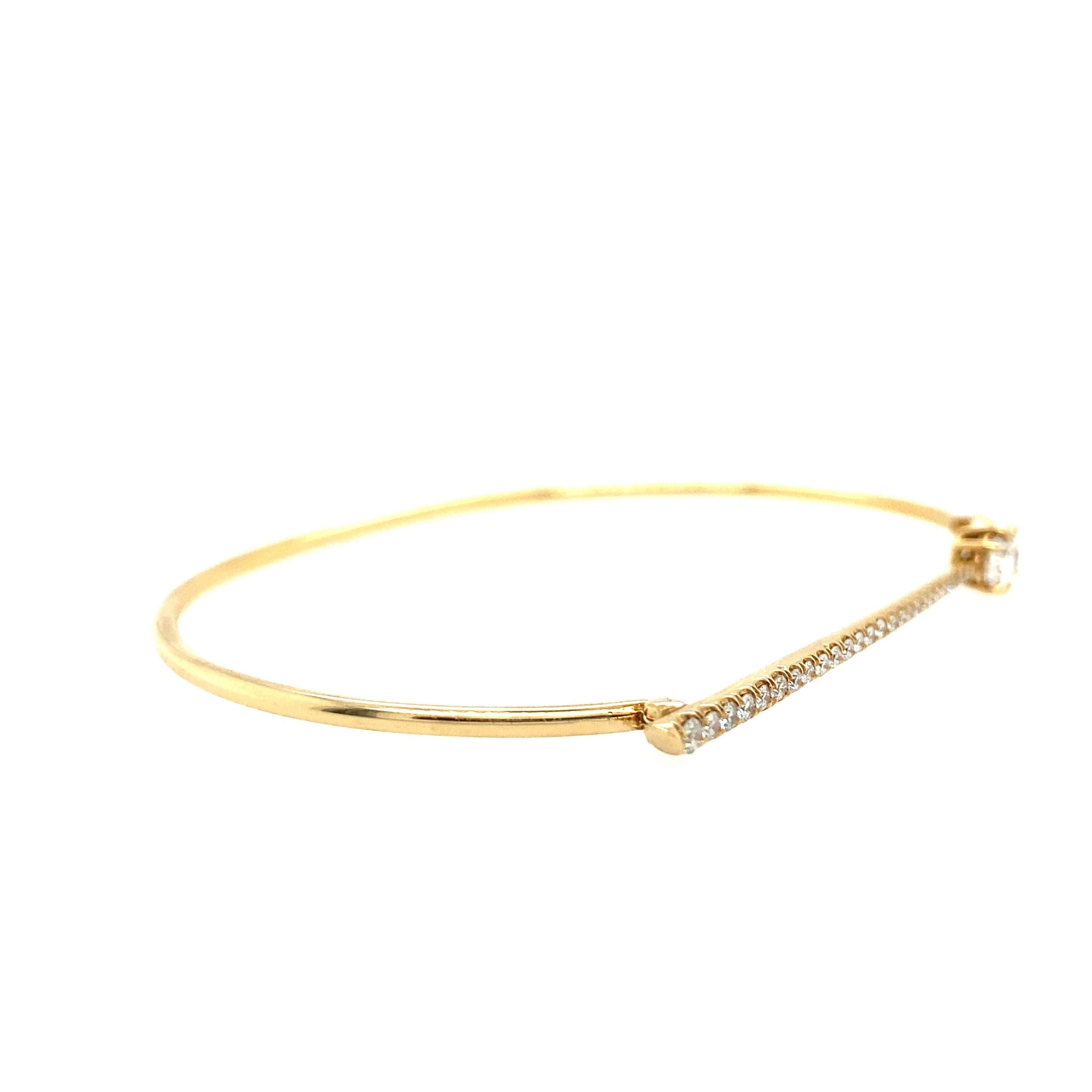Modern and sleek, this 18k yellow gold and diamond bar bangle is the epitome of designer Jade Trau's pieces. Every piece of Jade Trau jewelry is handmade in New York City to exacting standards and features 0.61tcw of ethically sourced H color and