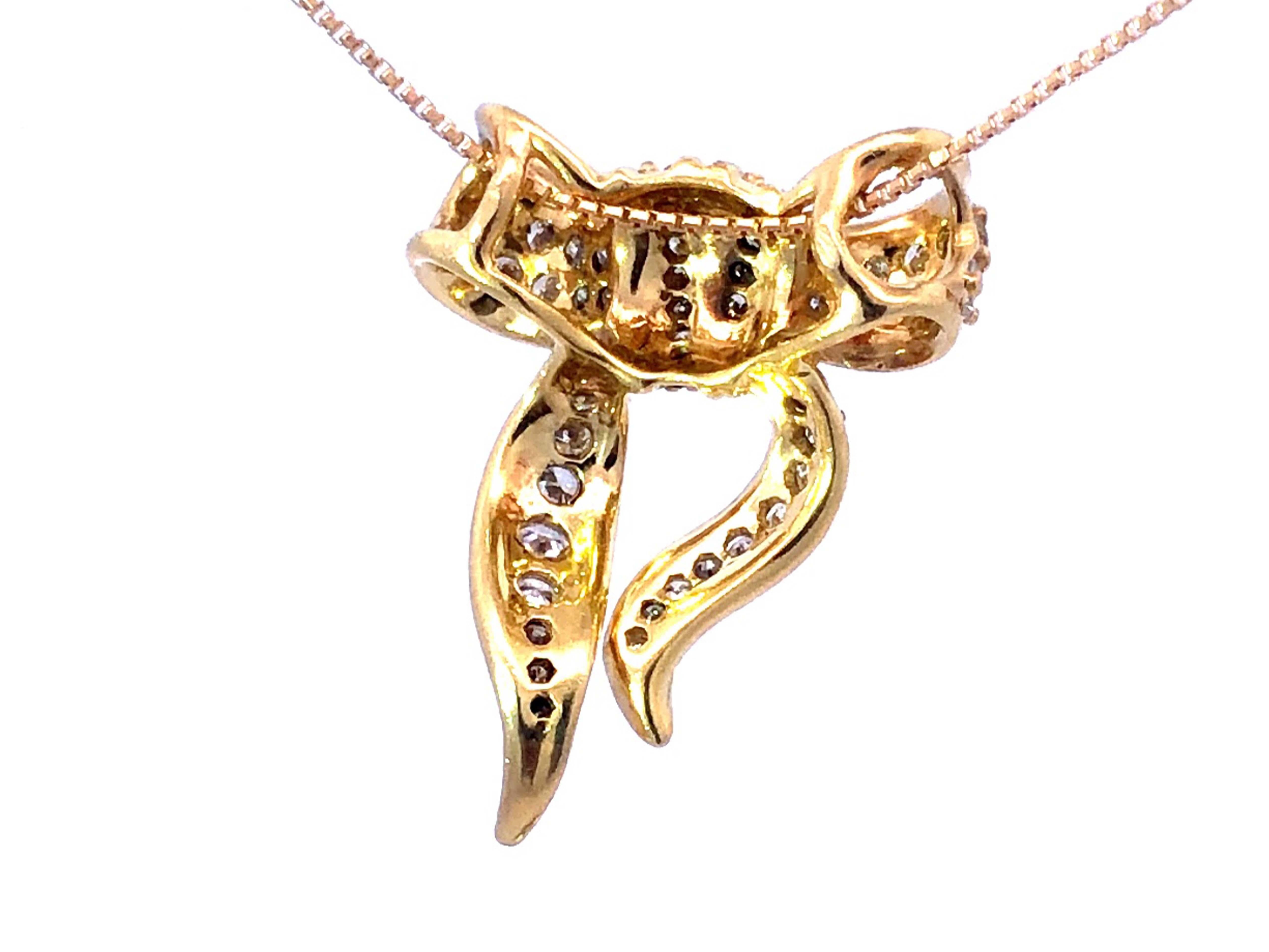 Anhänger und Kette aus 18 Karat Gelbgold mit Diamantschleife 1