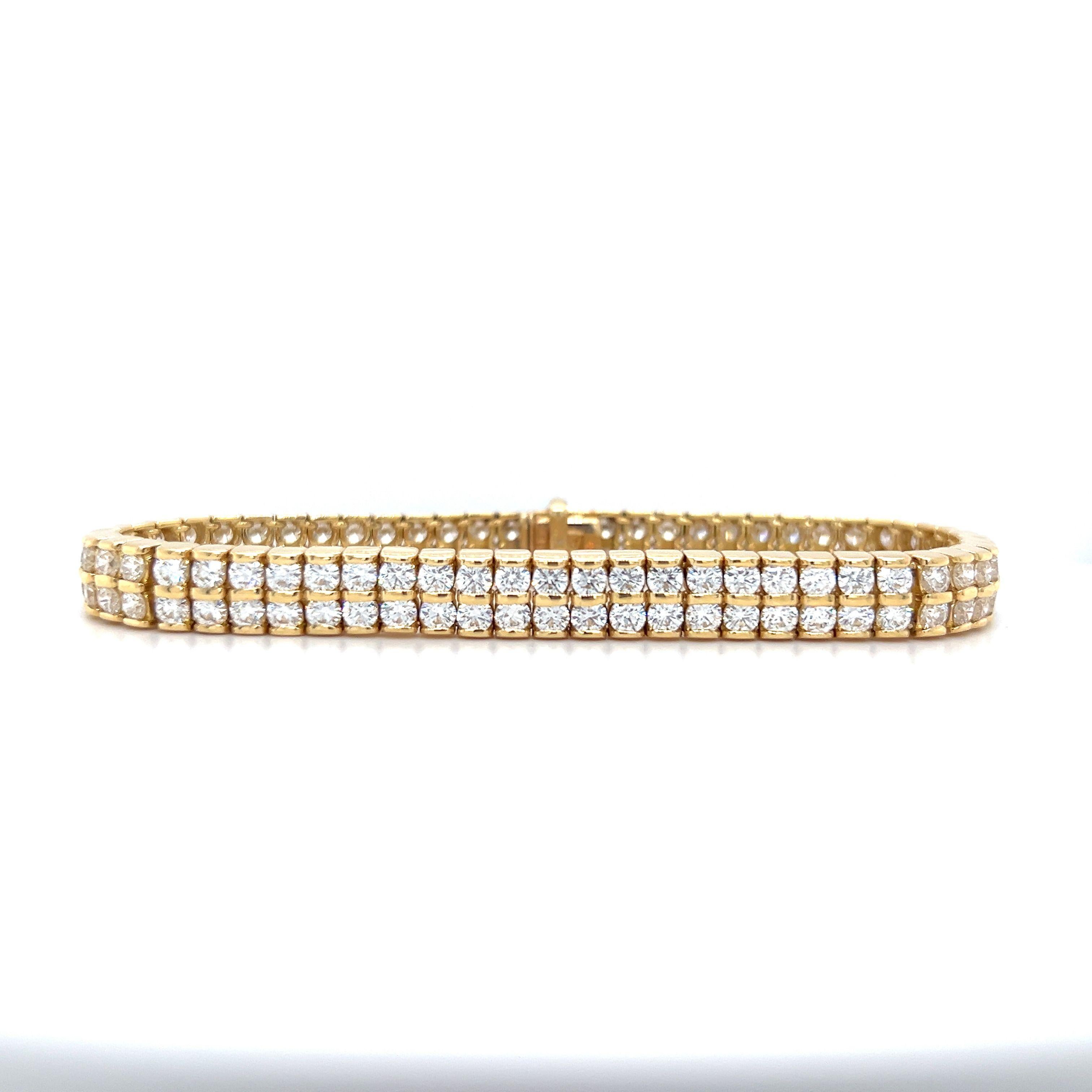 This stunning bracelet features 118 diamonds, arranged in a double row style. These high quality diamonds are 10.09 carats total weight, F-G color, and VS1 clarity. Crafted in 18k yellow gold, this bracelet is guaranteed to sparkle.