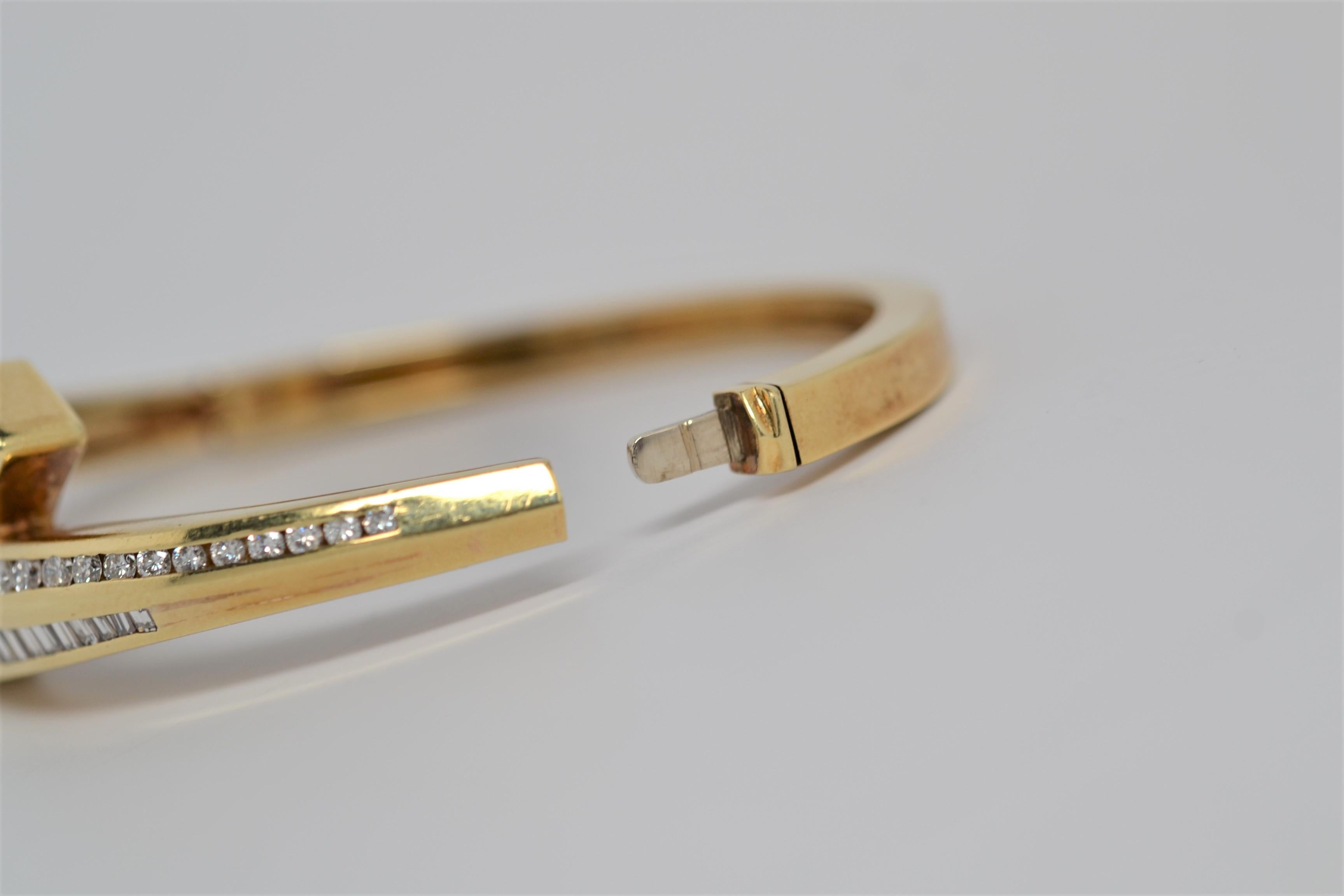 An 18K Yellow Gold By Pass Bracelet set with Round Brilliant Cut and Baguette Diamonds. The bracelet utilizes a traditional clasp with hinge. There are thirty six Baguette Diamonds weighing 3.50ct that have been custom cut to fit and calibrated for