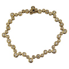 Bracciale da tennis con diamanti a cerchio in oro giallo 18 carati #21809