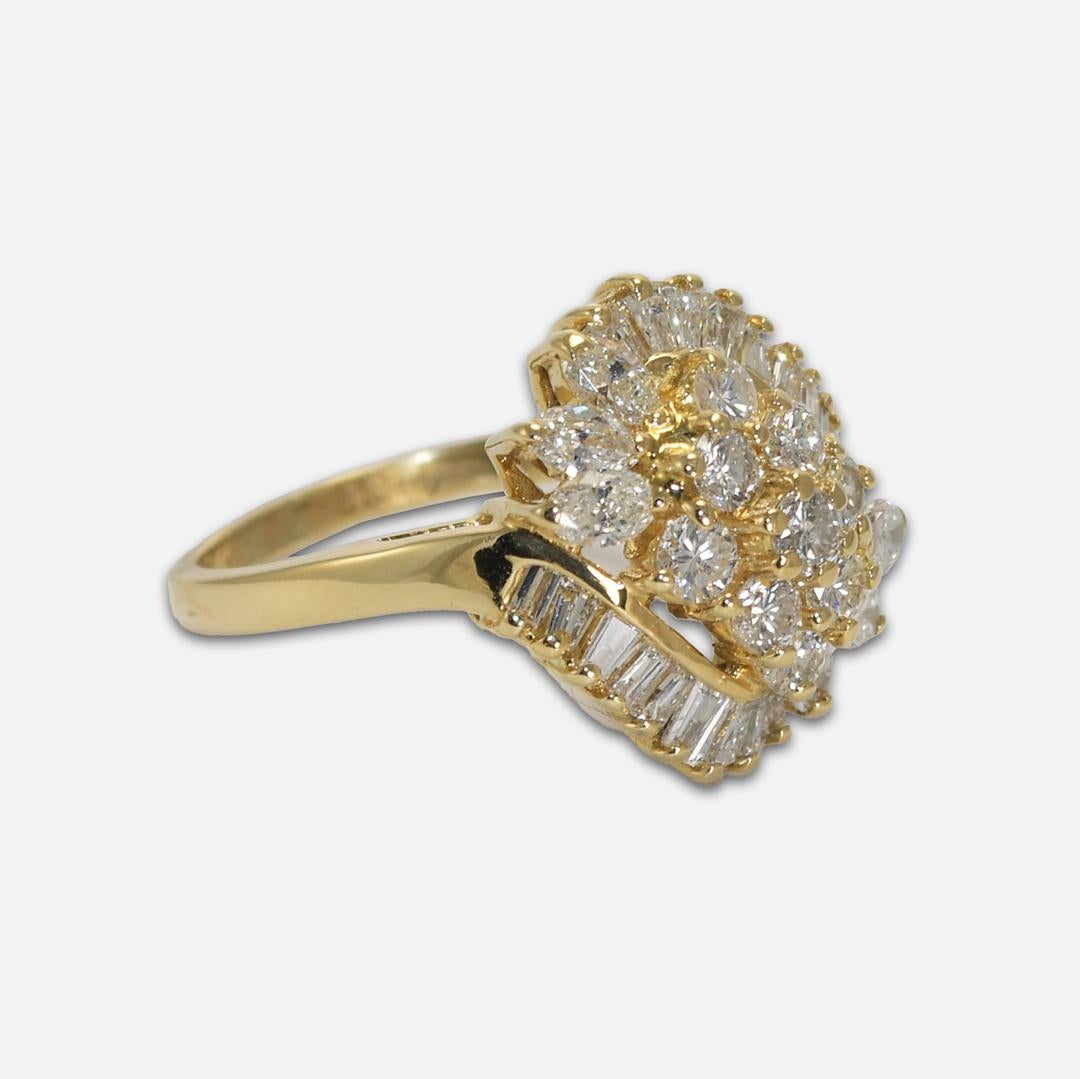 18k Yellow Gold Diamond Cluster Ring.
A mix of baguettes, marquise, and round brilliant cut diamonds.
There is 1.50tdw. 
All diamonds are in H-I color, mostly VS clarity, and some SI.
Stamped and tests 18k, weighs 7 grams.
Size 8, can be sized up or