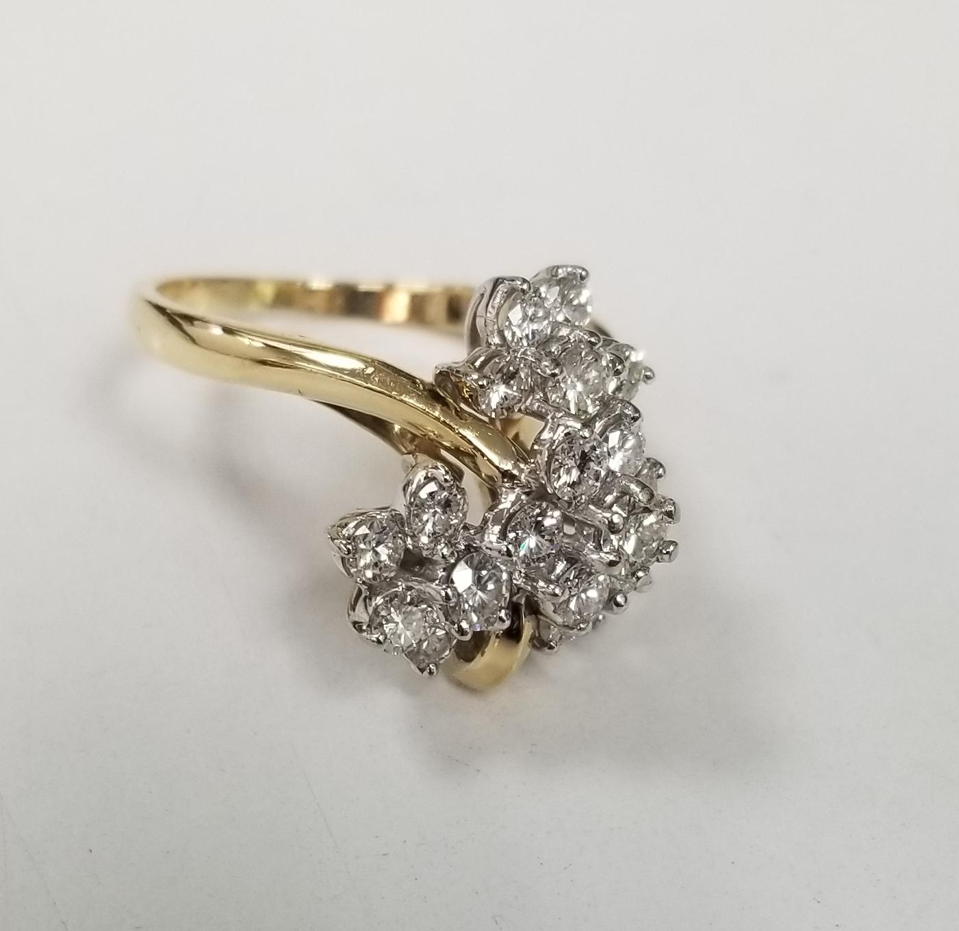 Specifications:
    main stone: ROUND DIAMONDS
    DIAMONDS: 19 PCS
    CARAT TOTAL WEIGHT: APPROXIMATELY 1.50 CTS
    color: G
    clarity: VS
    brand: UNBRANDED
    metal: 18K YELLOW GOLD
    type:  RING
    weight: 6.2 GRS 
    SIZE: 6.75US


