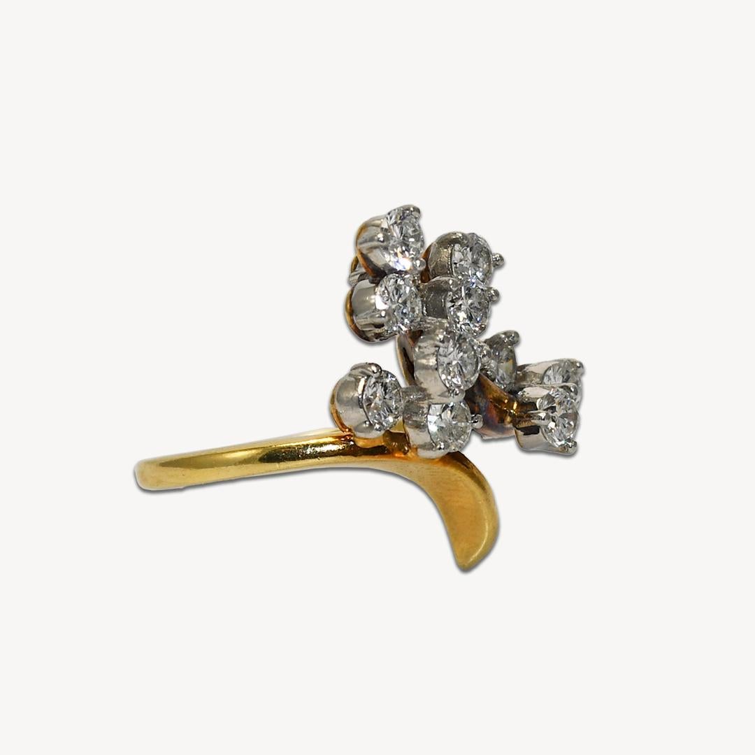 Diamond cocktail ring in 18k yellow gold.
Stamped 18k and weighs 6.3 grams.
There 12 round brilliant cut diamonds, h-I color, VS-SI1 Clarity, very good cuts.
The diamonds are prong set in platinum heads for durability.
The ring is well made and in