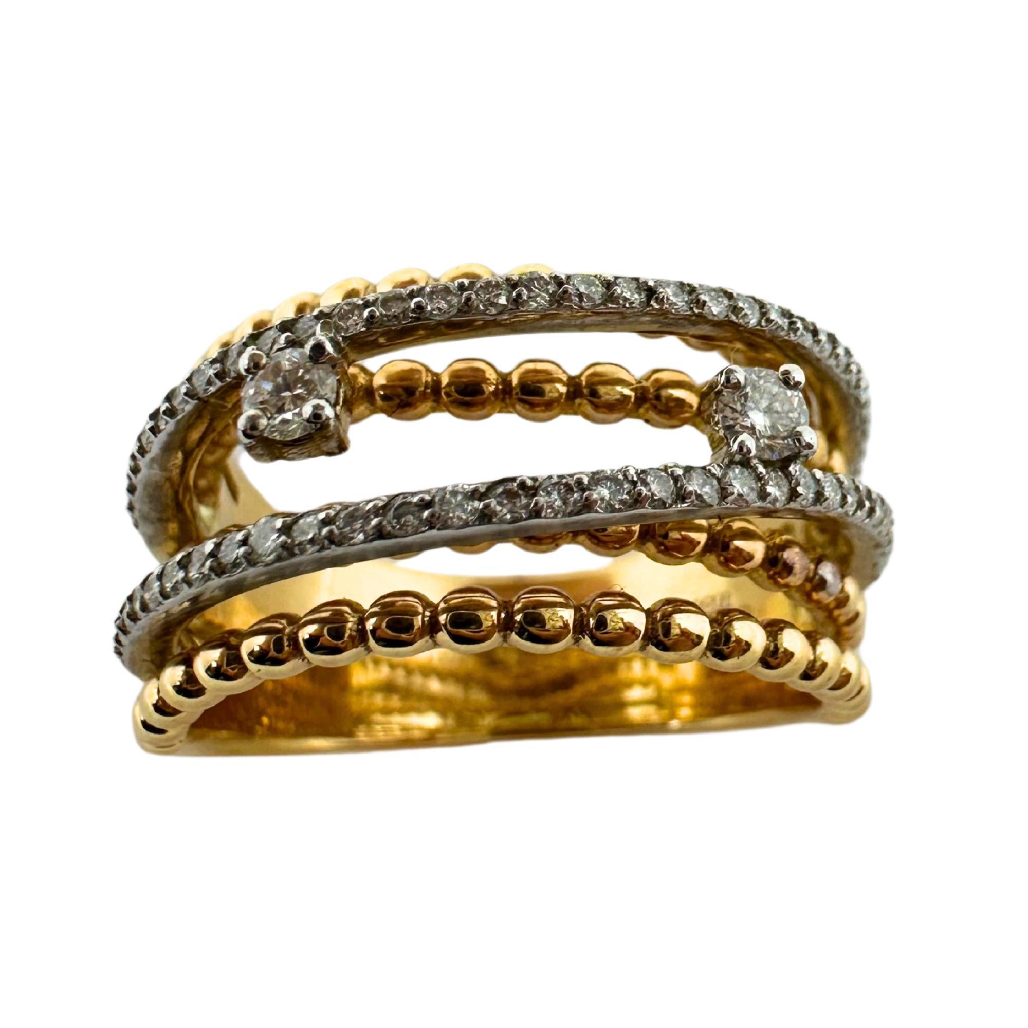 This stunning 18k yellow gold ring features a wide band design that creates a unique and eye-catching look. The crossover style adds a touch of elegance and the 0.43 carats of diamonds add a touch of sparkle. In good condition with a weight of 9
