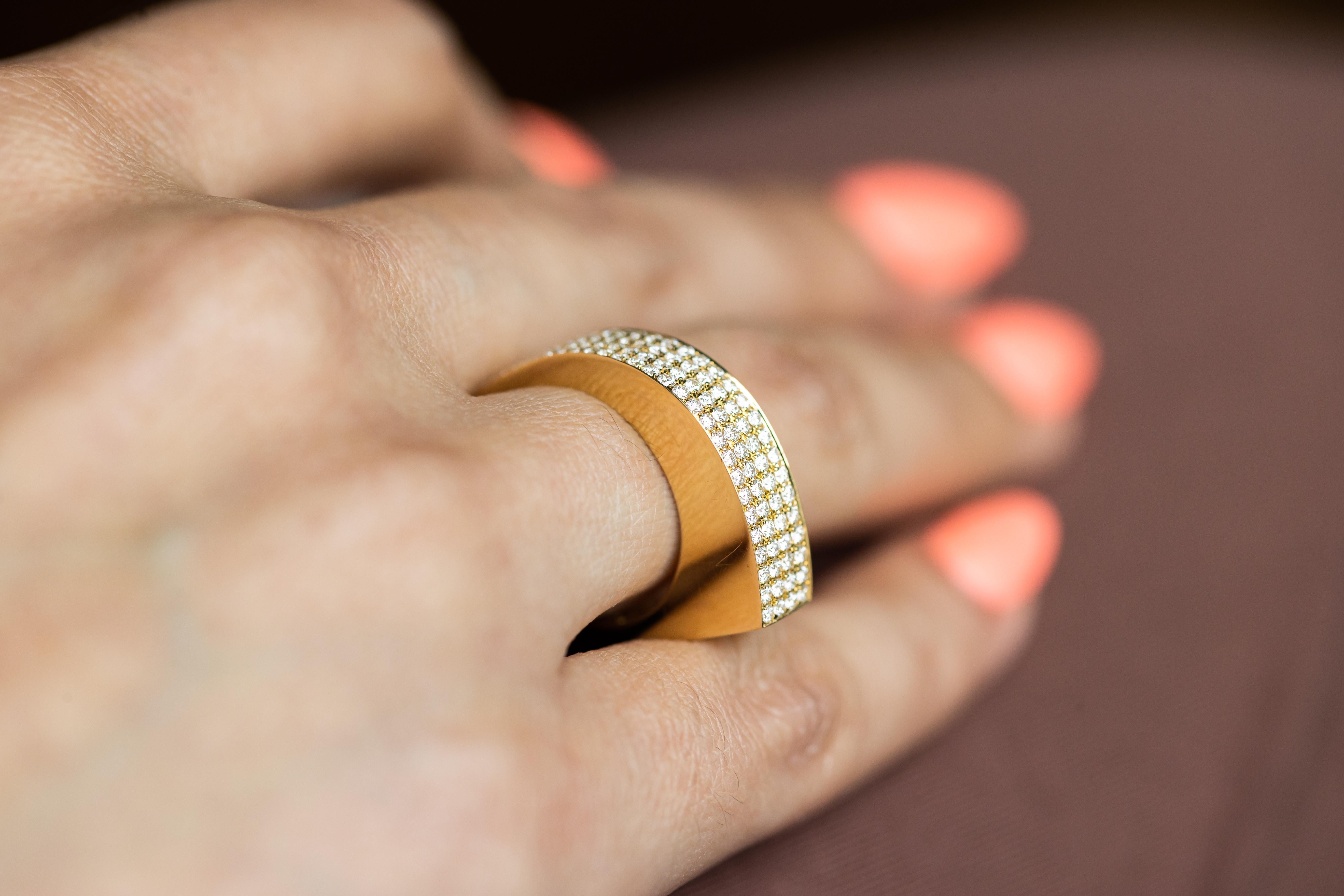 Discover the epitome of luxury with our 18K Yellow Gold Diamond Pave Curve Ring, featuring 0.95 carats total weight of sparkling diamonds. This exquisite piece is designed to captivate and impress, making it a perfect choice for special occasions or