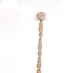 Orecchini pendenti in oro giallo 18k con diamanti e perle dorate