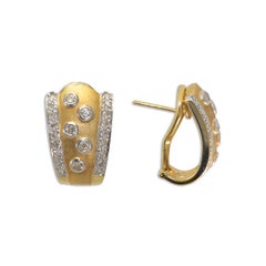 Orecchini con diamanti in oro giallo 18K 0,50ct