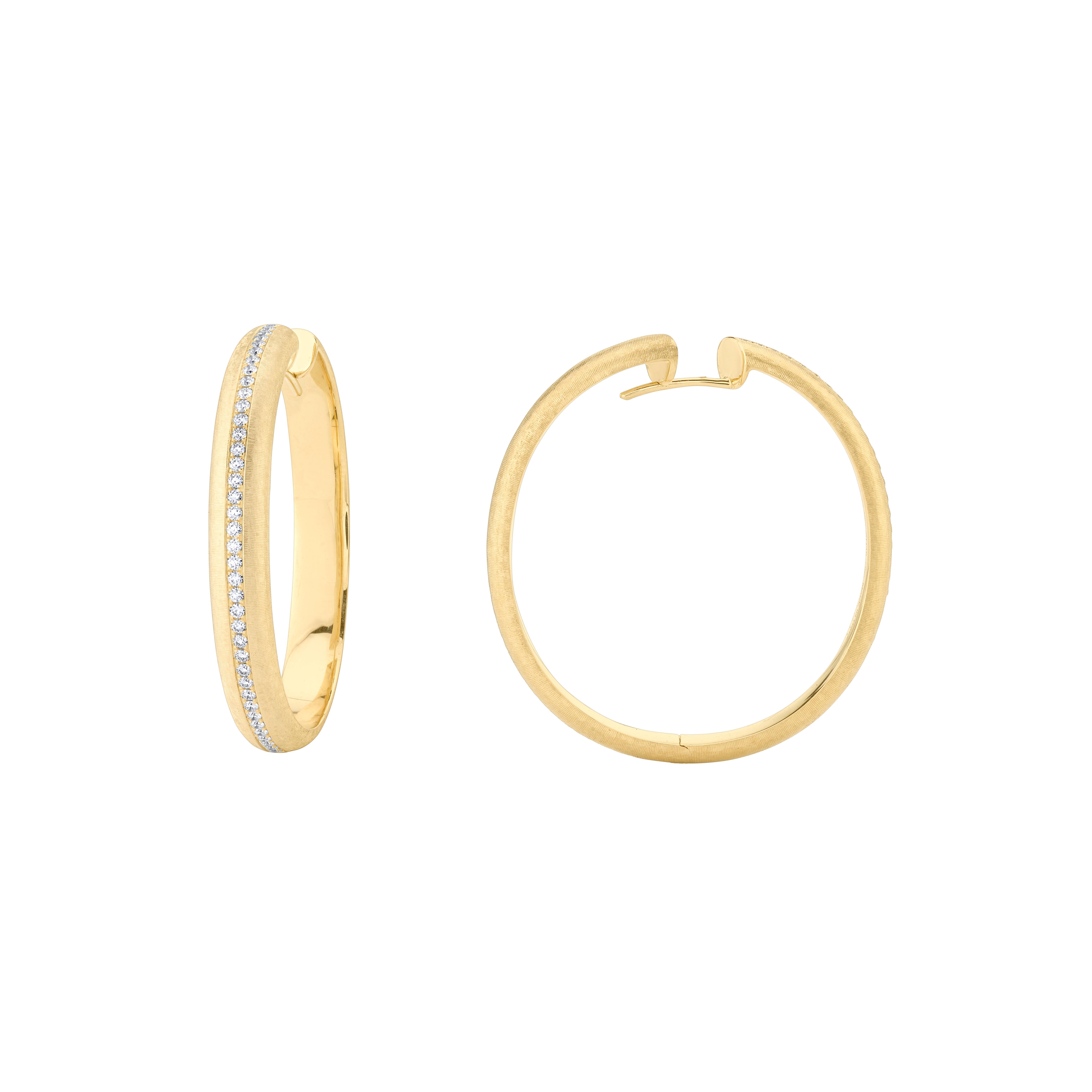 Style #: XH35E.
SYLVIA KONTENTE  18K Yellow gold diamond hoop earrings with hand-engraved finish.
Precision-cut, round brilliant diamonds.
Diamond total weight: 0.71ct tw.
Diamond color/clarity: DEF/VVS VS.
Hand-engraved finish - The ancient art of