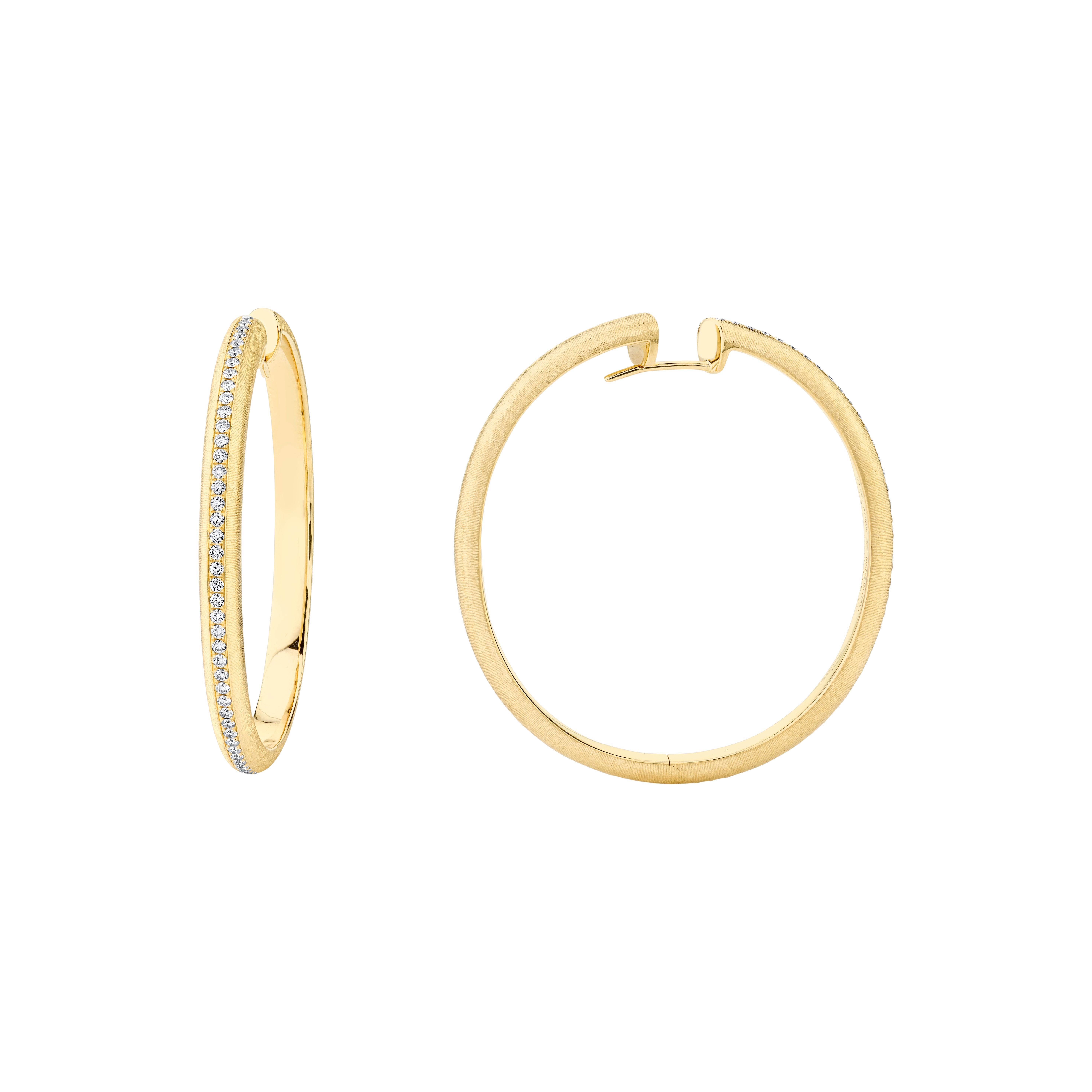 Style #: XH404E.
SYLVIA KONTENTE  18K Yellow gold diamond hoop earrings with hand-engraved finish.
Precision-cut, round brilliant diamonds.
Diamond total weight: 0.78ct tw.
Diamond color/clarity: DEF/VVS VS.
Hand-engraved finish - The ancient art of
