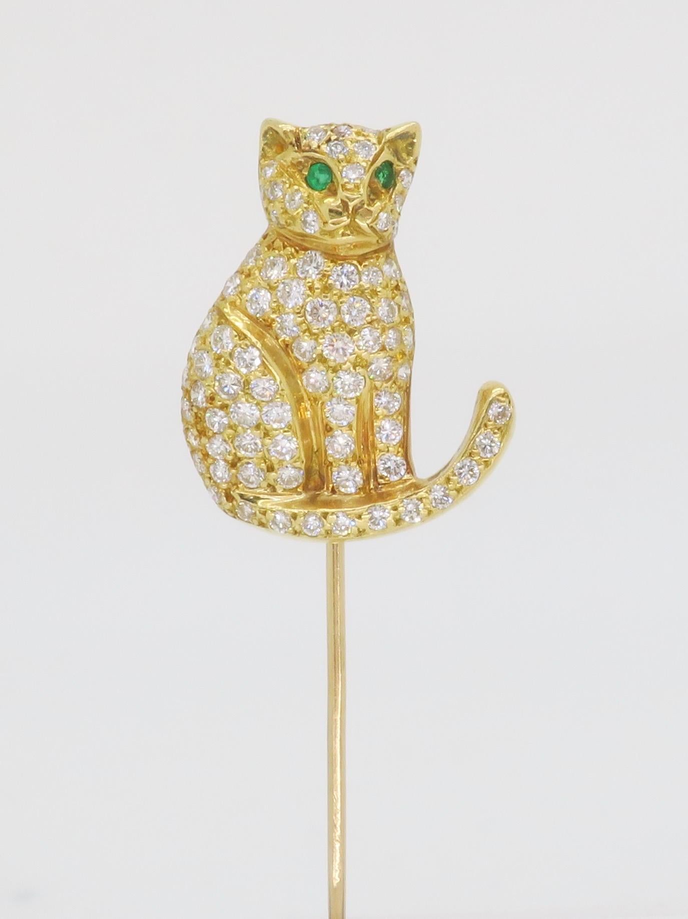 Stunning 18k Yellow Gold Diamond Cat stick pin with Emerald Eyes.

Gemstone: Diamond & Emerald 
Diamond Carat Weight: Approximately 1.02CTW
Diamond Cut: Round Brilliant Cut Diamonds
Diamond Clarity: VS1-VS2
Diamond Color: E-G
Stamped: 