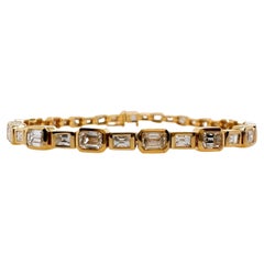 Bracelet tennis en or jaune 18 carats avec diamants taille émeraude et baguette