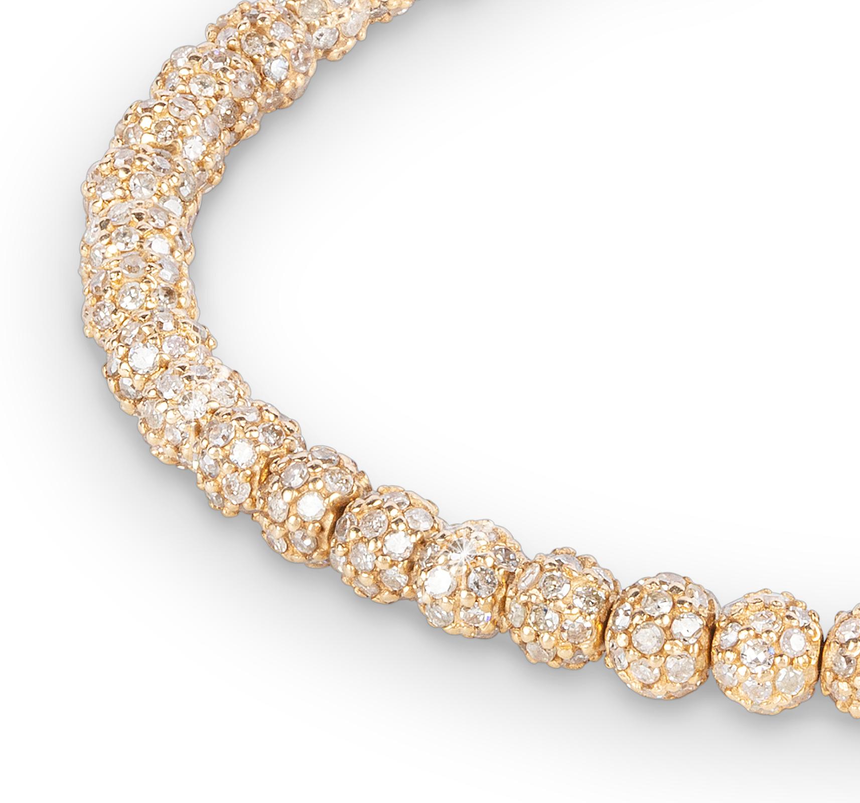 A new take on a classic tennis bracelet. THEVAULT15's handmade 18-karat gold bracelet is encrusted with sparkling free turning diamond beads and a double-sided diamond clasp. Each bead is created with the highest accuracy by our artisans for
