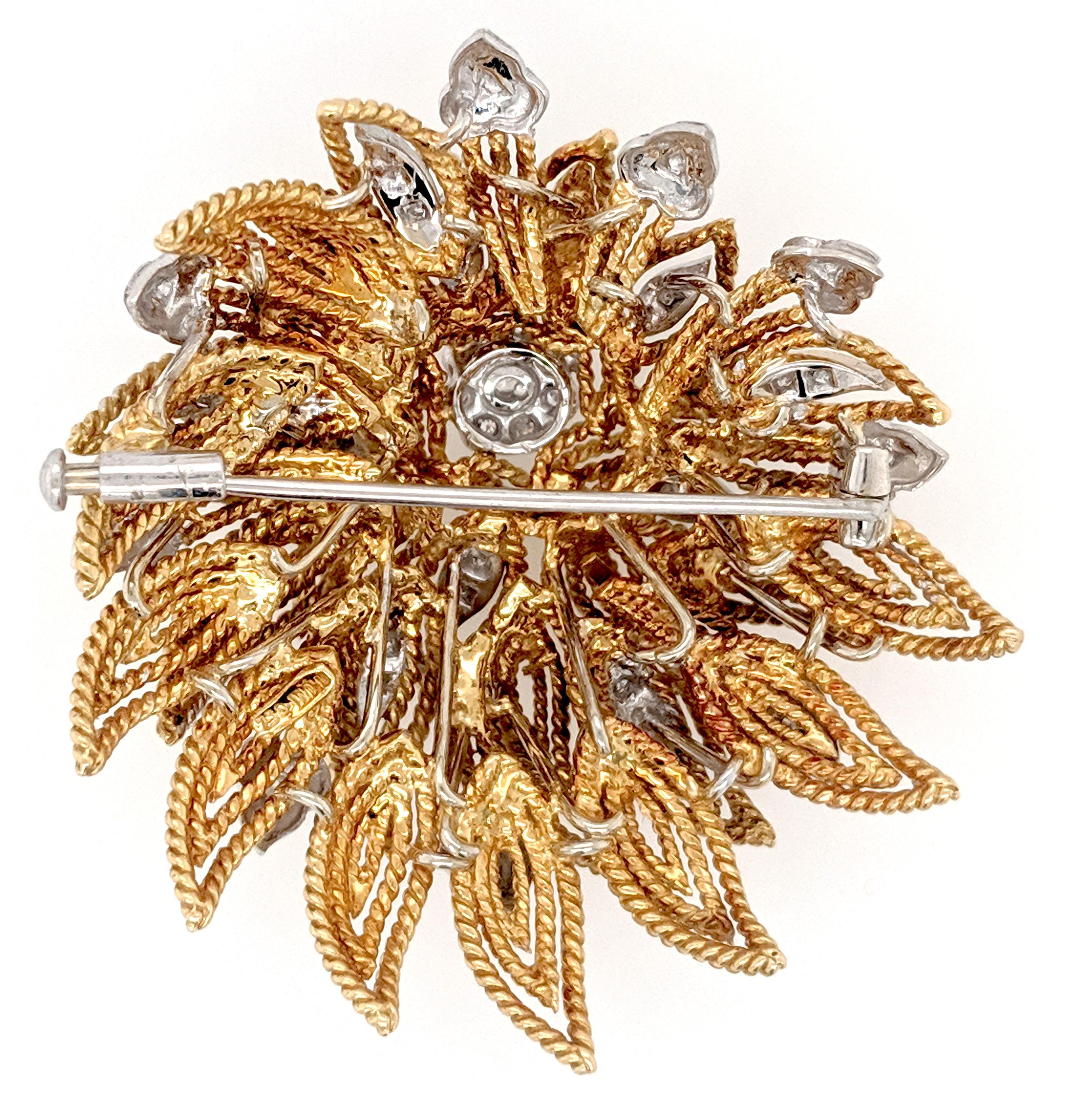 A diamond Flower Brooch crafted in 18k yellow gold featuring (38) round brilliant diamonds weighing approximately .50cttw with a color of G/H and a clarity of SI1 to SI2

The brooch measures 2
