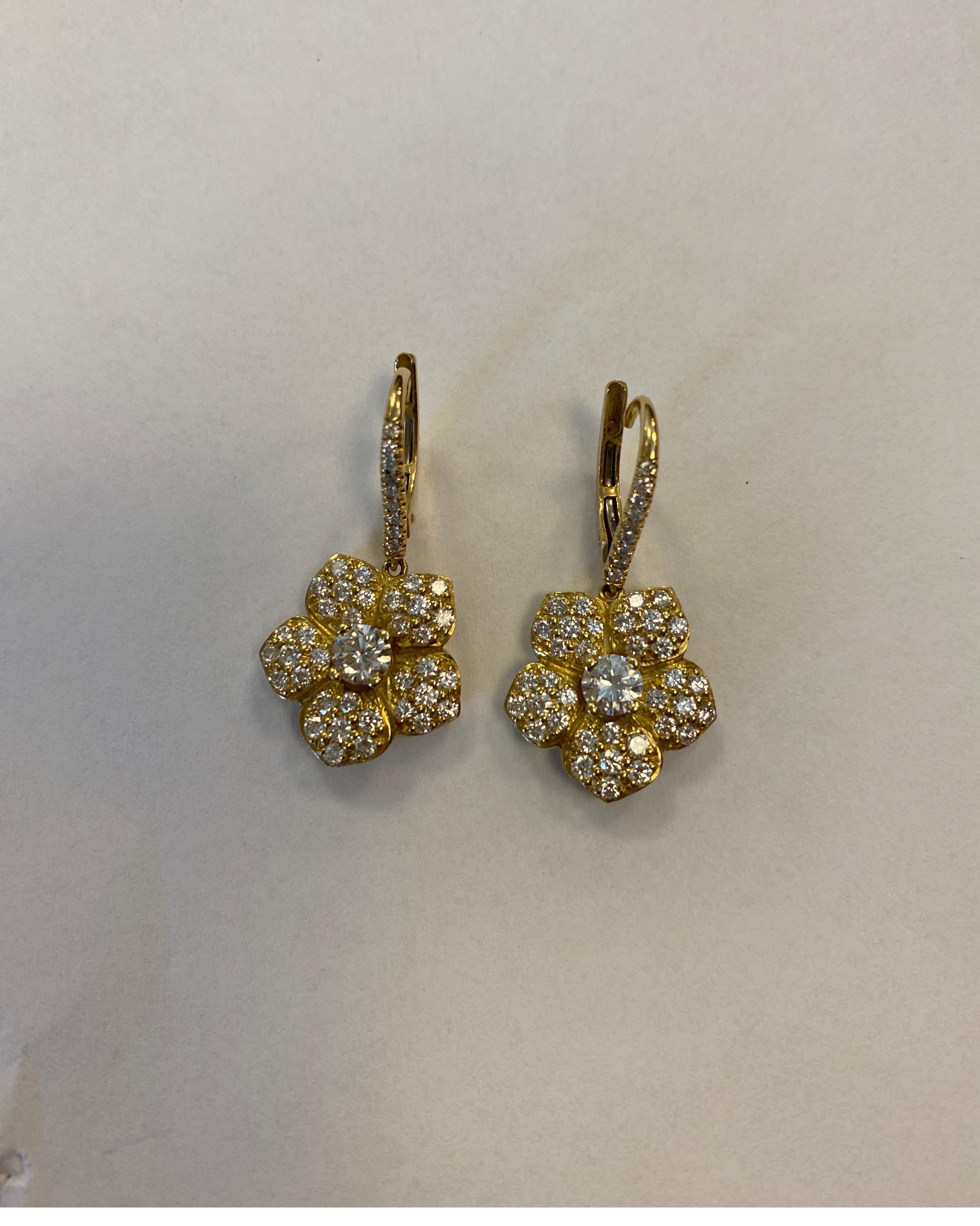 18K yellow gold diamond flower design drop earrings set with 90 full cut round diamonds weighing 1.89cts.
retail $6500 