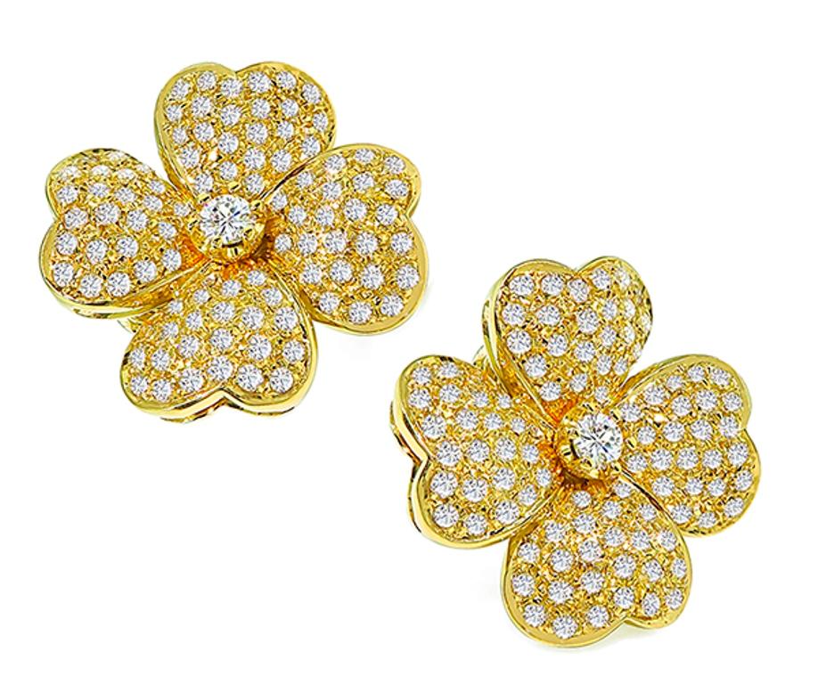 This elegant pair of 18k yellow gold flower earrings feature sparkling round cut diamonds that weigh approximately 4.00ct. graded G-H color with VS clarity. The earrings measure 25mm by 25mm and weigh 26.4 grams. They are stamped 750.

inventory