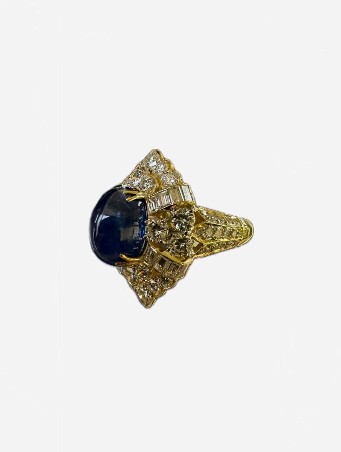 DeKara Design Collection

Metal- 18K Yellow Gold, .750. 

Stones- GIA Certified Genuine Oval Cabochon Blue Sapphire 7.83 Carats, 54 Round Diamonds F-G Color VS1-VS2 Clarity, 16 Baguette Diamonds F-G Color VS1-VS2 Clarity, 4.02 Carats.

GIA Sapphire