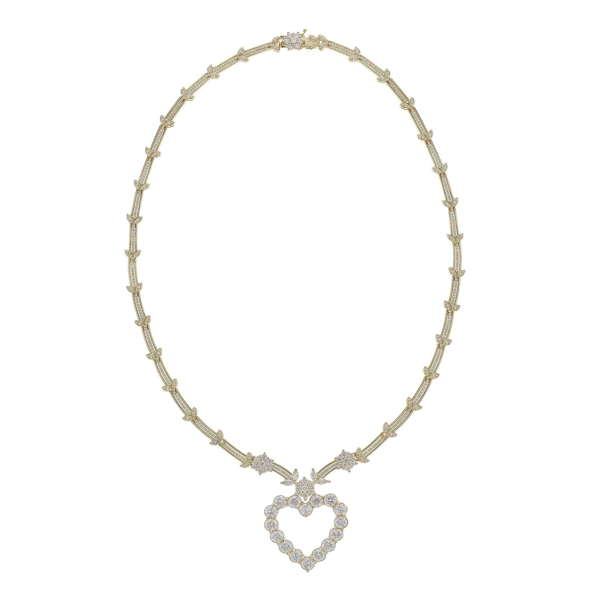 This necklace is made in features an 18K Yellow Gold. It features 449 round cut diamonds and 4 marquise diamonds. All stones are prong set and weigh 10.38 carats. With a color grade (H) and clarity grade (SI2).
