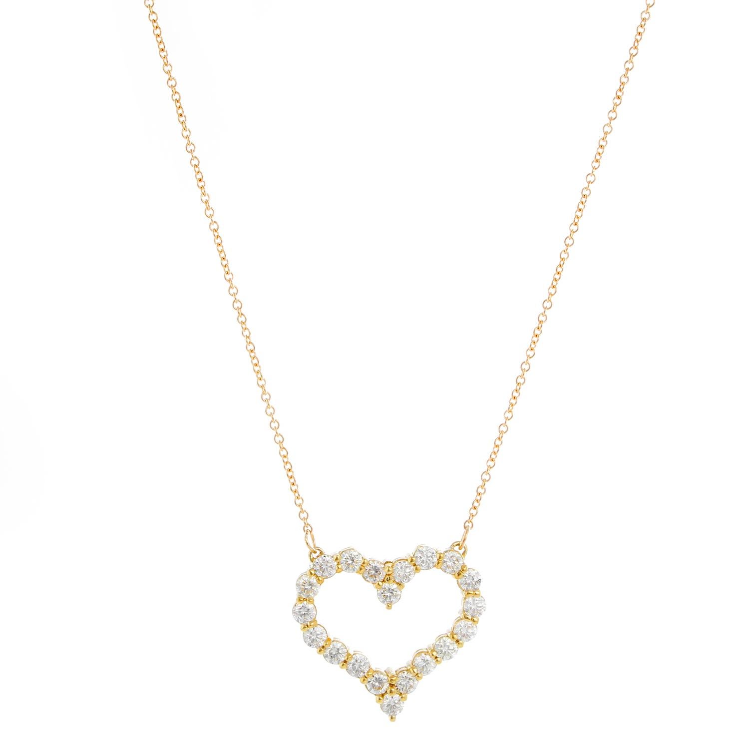 Beautiful heart pendant with 20 round brilliant diamonds set in 18K Yellow gold.  Weighing 3.22 cts. Clarity VS/SI1. Color H . Length 22 inches with 2