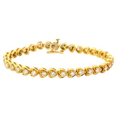 Bracelet tennis en or jaune 18 carats avec cœurs de diamants
