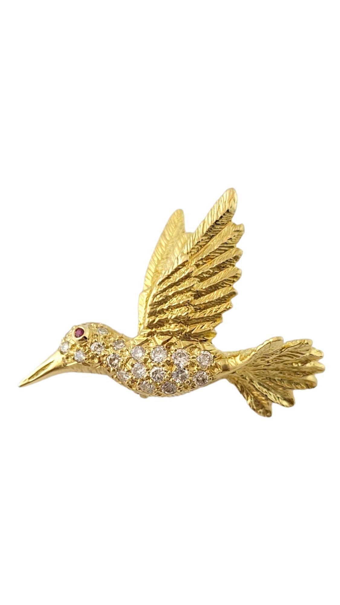 Vintage 18K Yellow Gold Diamond Hummingbird Pin 

This adorable hummingbird pin is crafted with meticulous detail out of 18K yellow gold and features 19 sparkling, round brilliant cut diamonds!

Approximate total diamond weight: .20 cts

Diamond