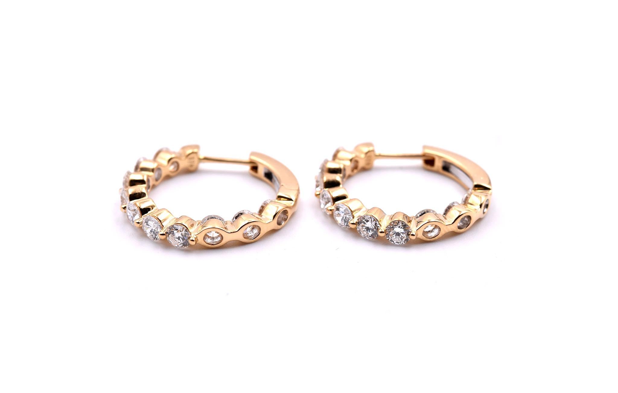 Designer: custom design
Material: 18k yellow gold
Diamonds: 20 round brilliant cut = 2.08cttw
Color: G
Clarity: VS
Dimensions: earrings are approximately 19.25mm in diameter 
Fastenings: hinged hoop 
Weight: 3.30 grams